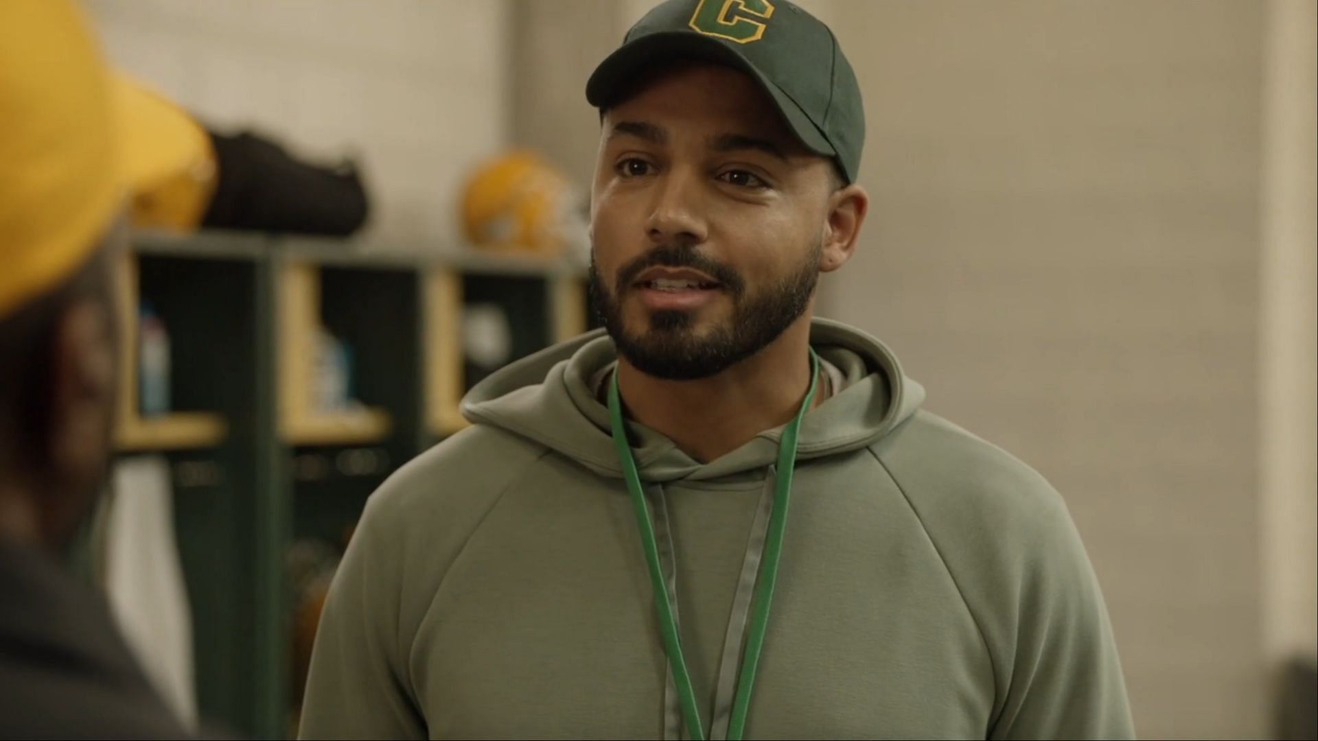 Osy Ikhile as Cassius Jeremy: The new football coach at Beverly Hills High, bringing a fresh perspective and new challenges for the team. ( Image via CW)