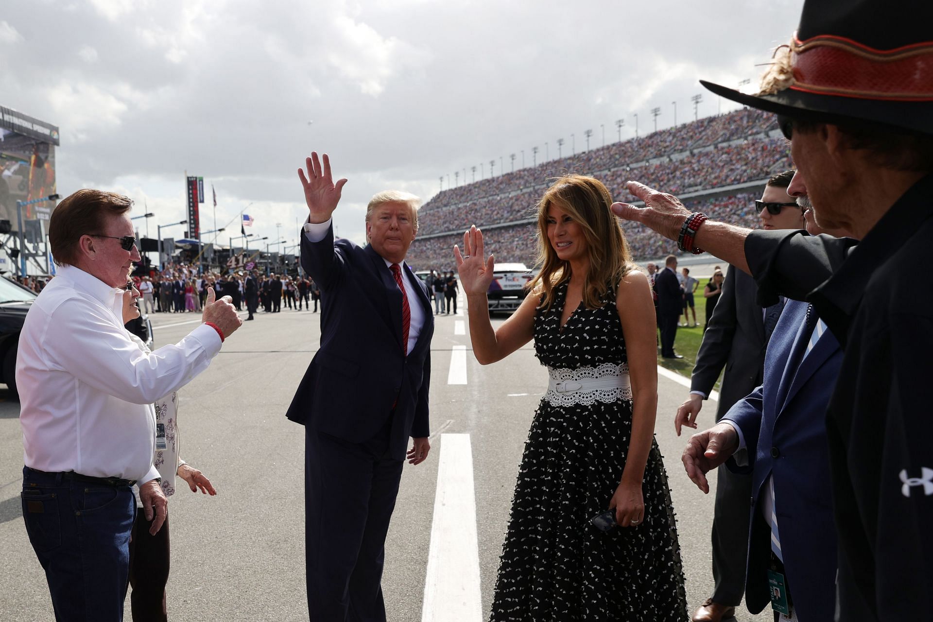 U.S. President Donald Trump and First Lady Melania Trump talk with Richard Childress prior to the NASCAR Cup Series 62nd Annual Daytona 500 at Daytona International Speedway on February 16, 2020 - Source: Getty Images