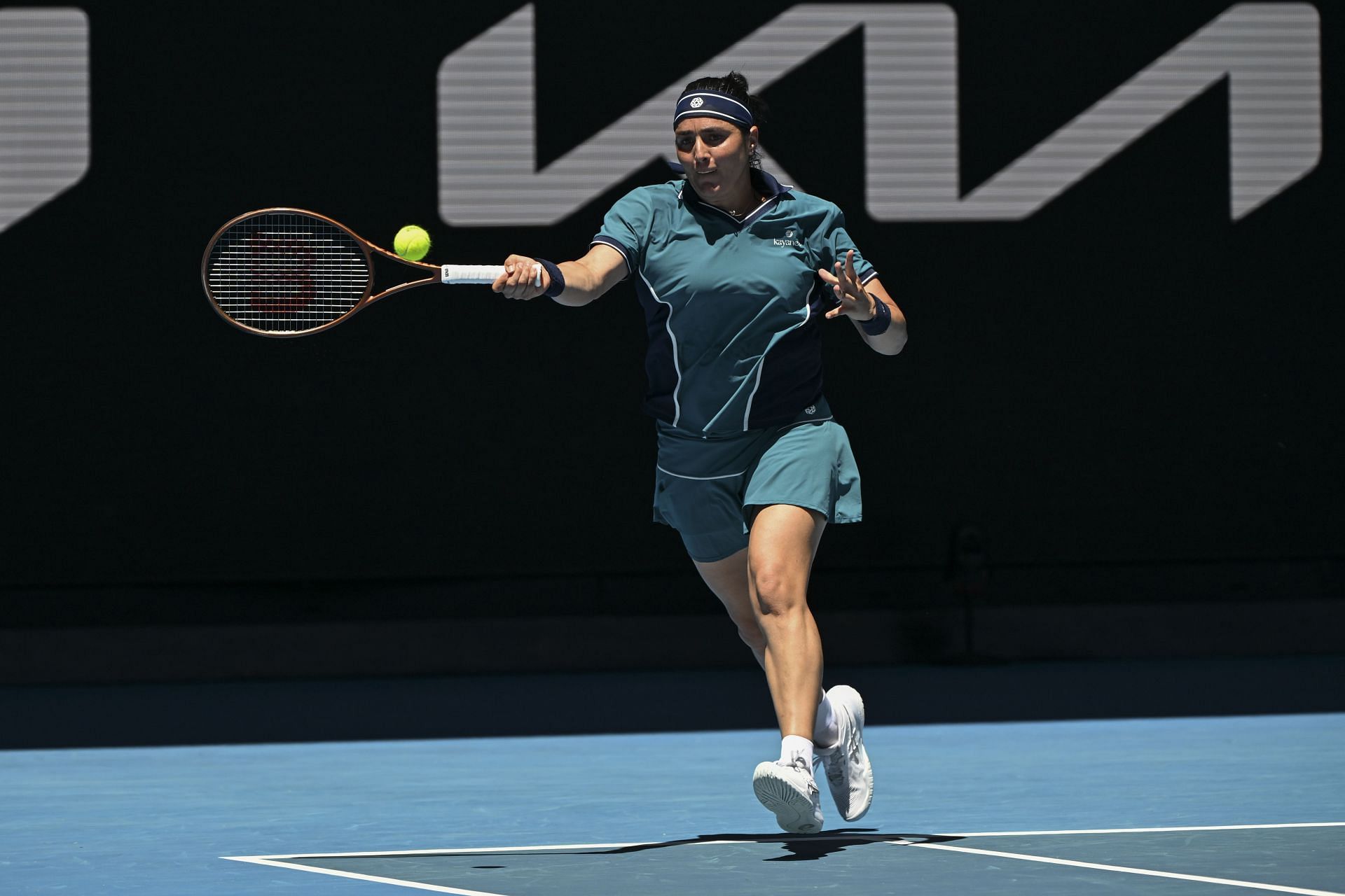 Jabeur plays a running forehand in the 2025 Australian Open - Source: Getty