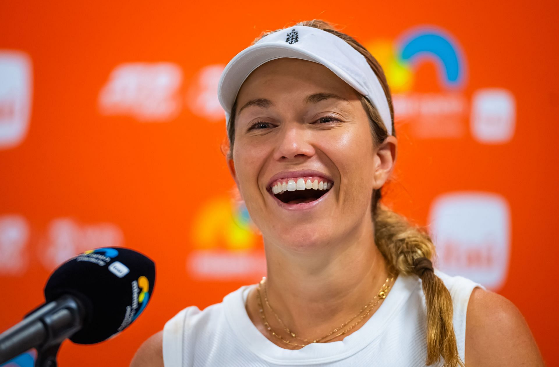 Danielle Collins pictured speaking at a press conference [Image Source: Getty Images]