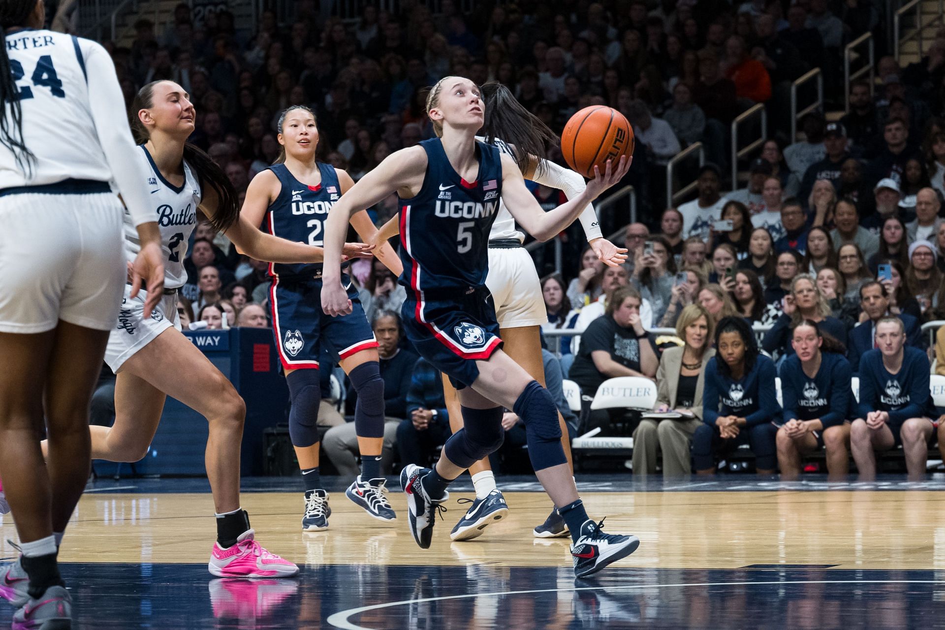 UConn Huskies guard Paige Bueckers (#5) drives past Butler Bulldogs guard Riley Makalusky (#2) for a layup during their game on February 22, 2025, at Hinkle Fieldhouse in Indianapolis. Photo: Getty