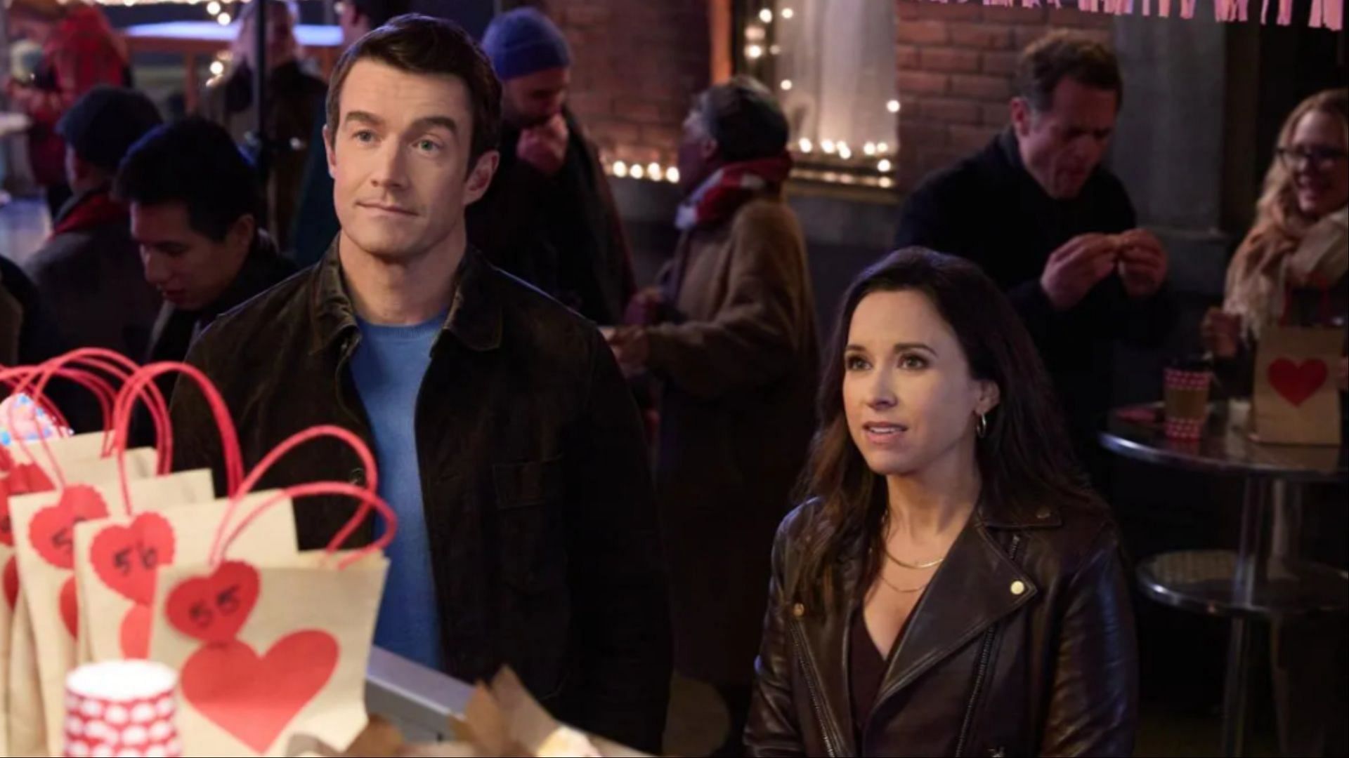 Robert Buckley as Finn and Lacey Chabert as Hannah in An Unexpected Valentine (Image via Hallmark) 