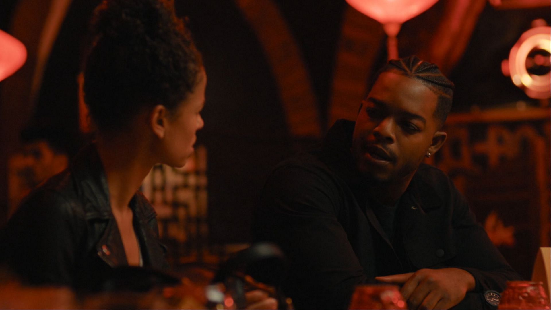 Sophie (Gugu Mbatha-Raw) and Thomas Baden (Stephan James) share a tense discussion in a bar during Surface season 1. Their conversation reveals pieces of Sophie&rsquo;s hidden past and her affair with Baden. ( Image via AppleTV+/Youtube)