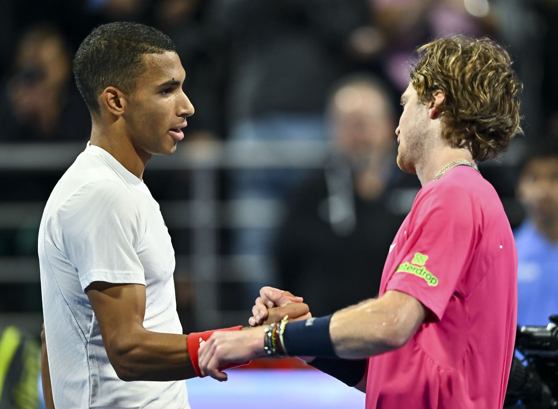 Felix Auger-Aliassime and Andrey Rublev shake hands after their semifinal contest at the 2025 Qatar Open. Source: Getty