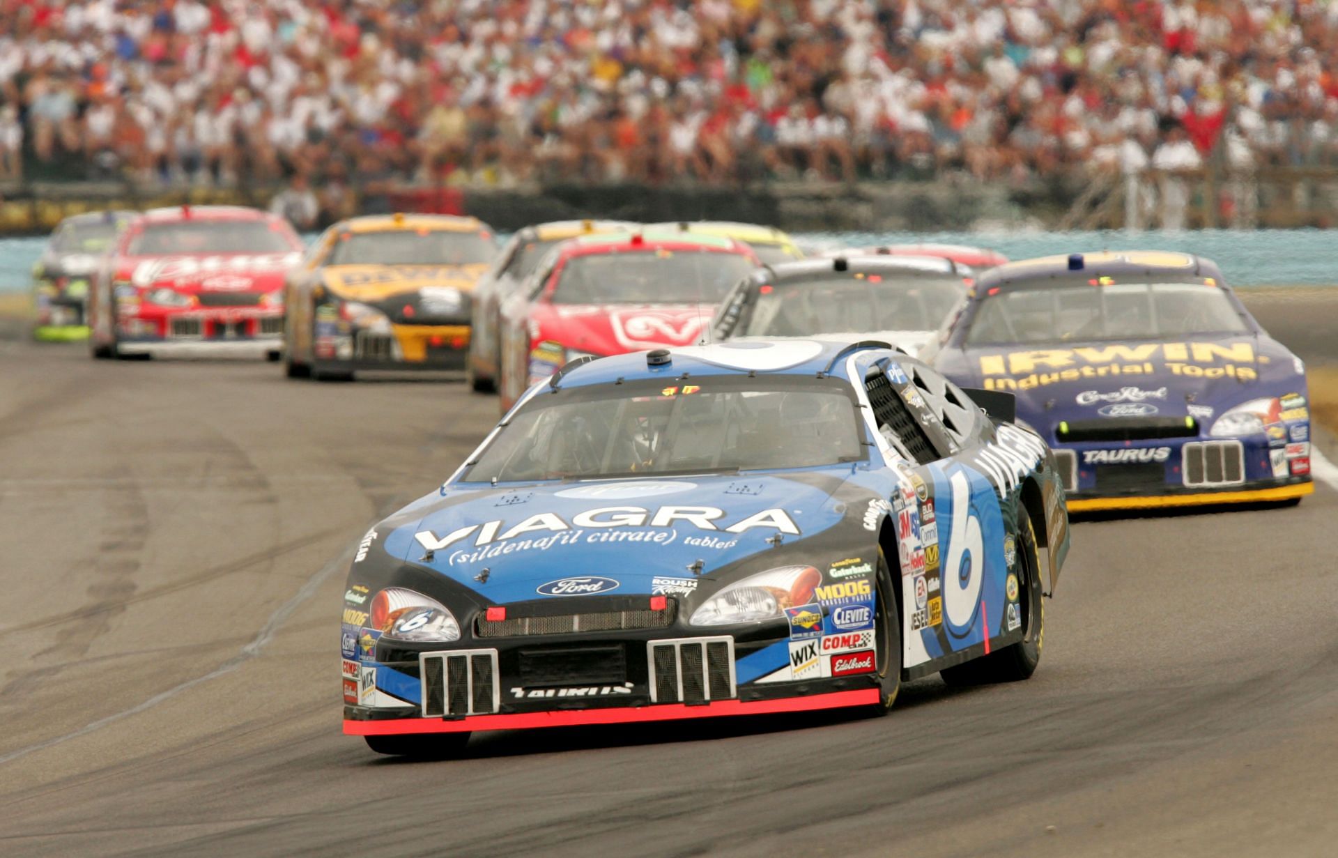 WATKINS GLEN, NY - AUGUST 14:  Mark Martin driver of the #6 Viagra Ford leads a pack of cars during the NASCAR Nextel Cup Series Sirius Satellite Radio at the Glen on August 14, 2005 at the Watkins Glen National Raceway in Watkins Glen, New York.  (Photo by Nick Laham/Getty Images) - Source: Getty