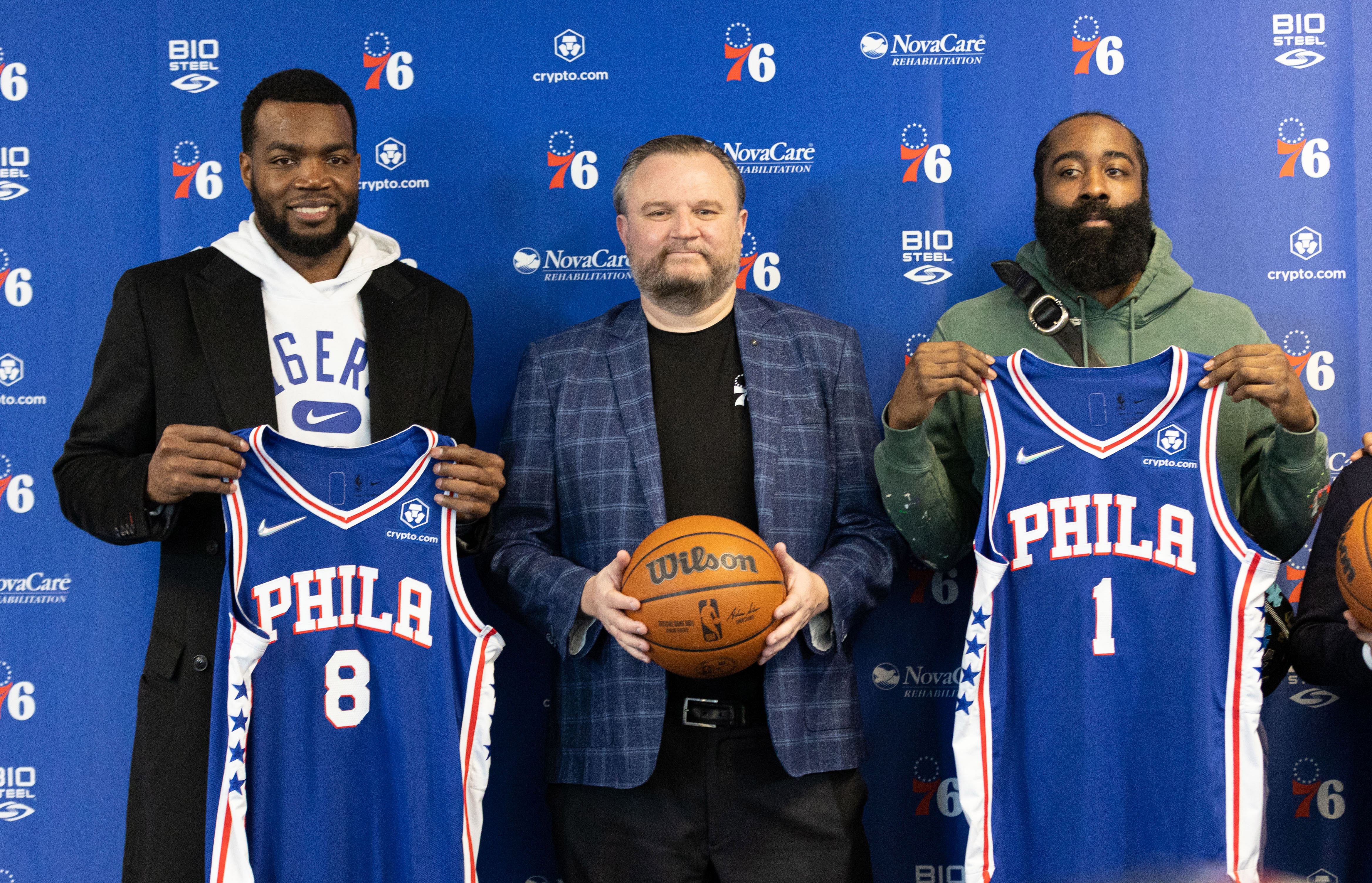 Feb 15, 2022; Camden, NJ, USA; Philadelphia 76ers forward Paul Millsap (8) and guard James Harden (1) and president of basketball operations Daryl Morey (M) pose for a photo after speaking with the media at Philadelphia 76ers Training Complex. Mandatory Credit: Bill Streicher-Imagn Images - Source: Imagn