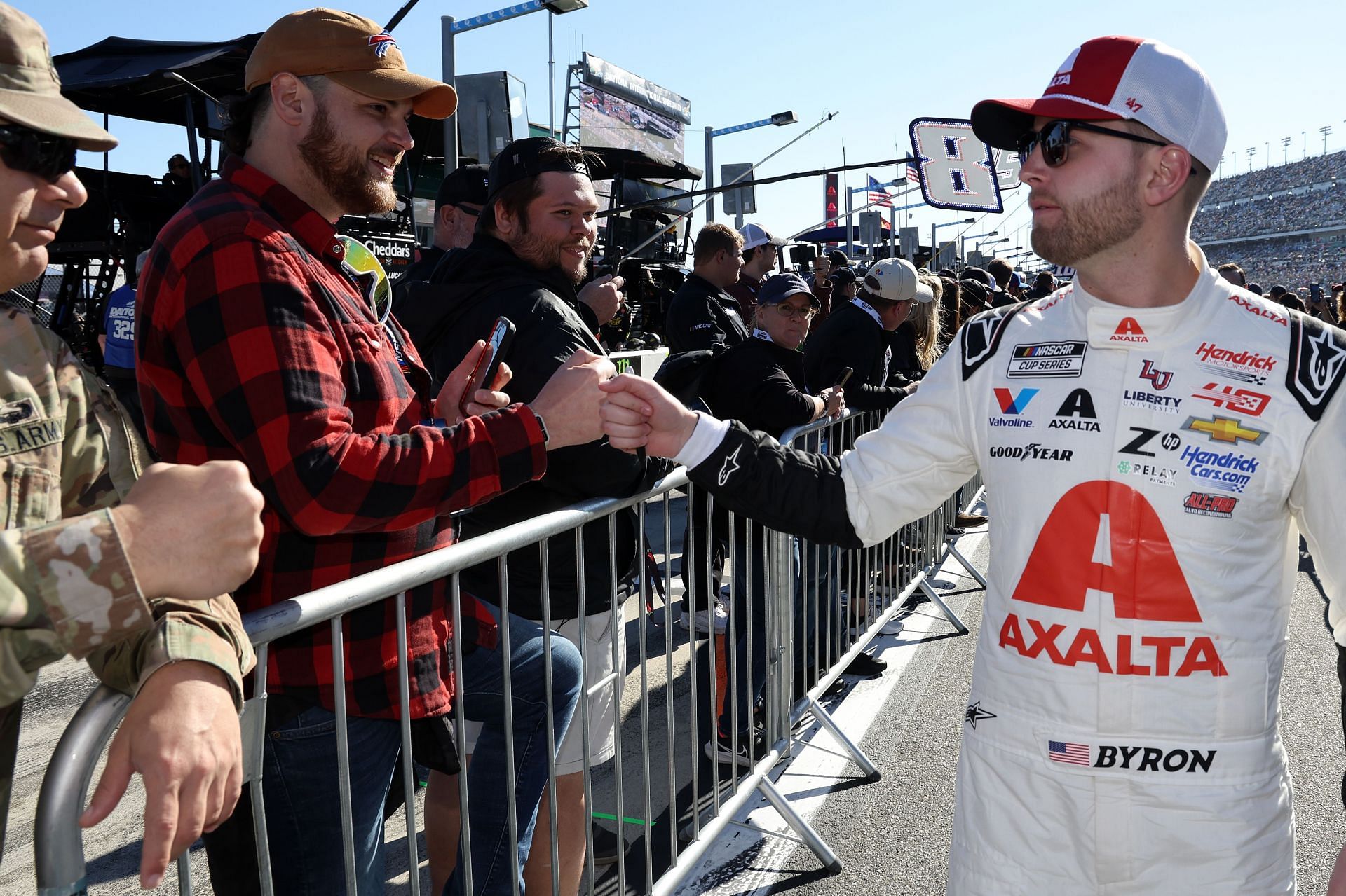 William Byron, driver of the #24 Axalta Chevrolet, greets fans on the grid prior to the NASCAR Cup Series Daytona 500 at Daytona International Speedway on February 19, 2024- Source: Getty