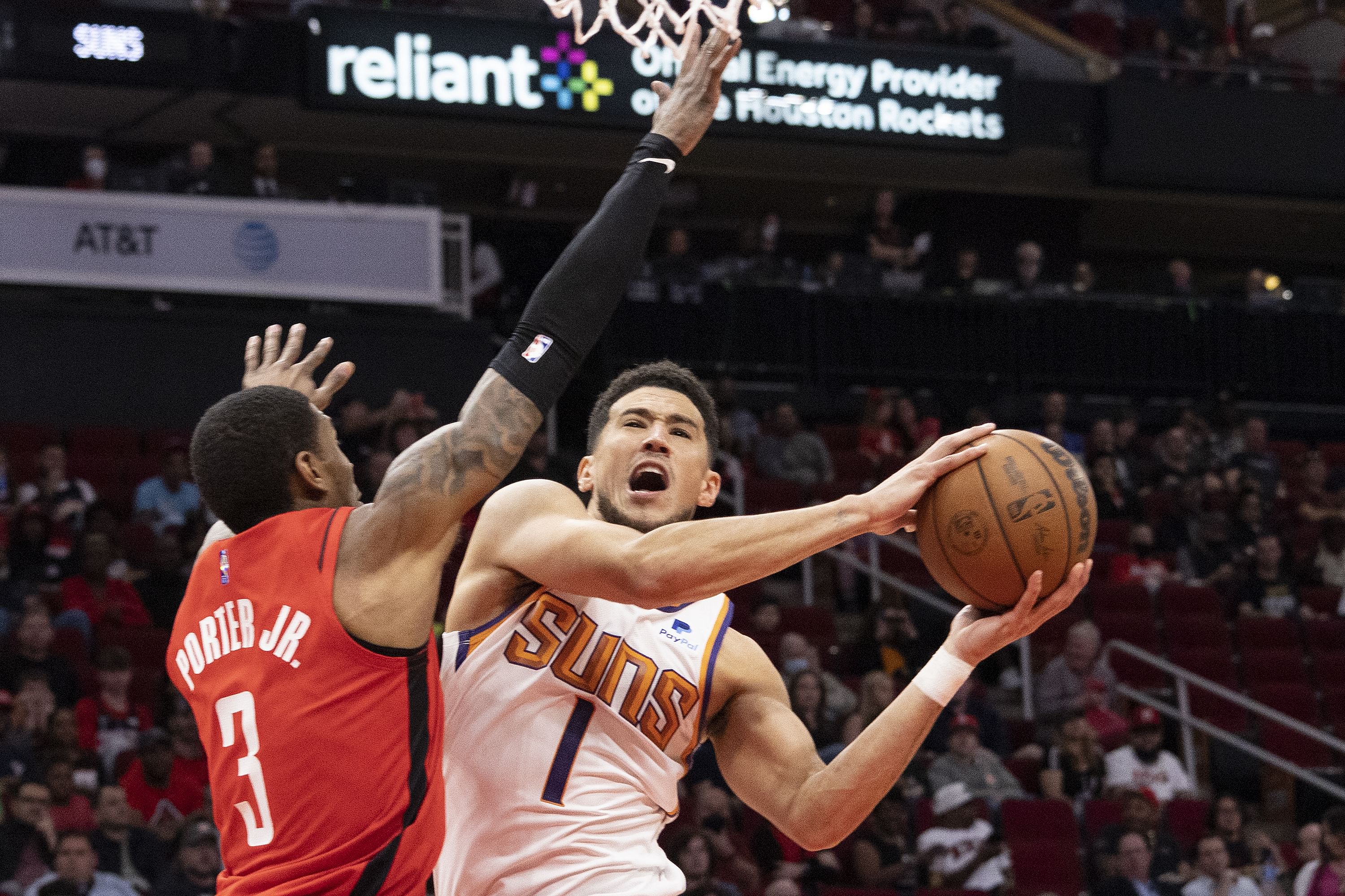 Mar 16, 2022; Houston, Texas, USA; Phoenix Suns guard Devin Booker (1) shoots against Houston Rockets guard Kevin Porter Jr. (3) in the first quarter at Toyota Center. Mandatory Credit: Thomas B. Shea-Imagn Images - Source: Imagn