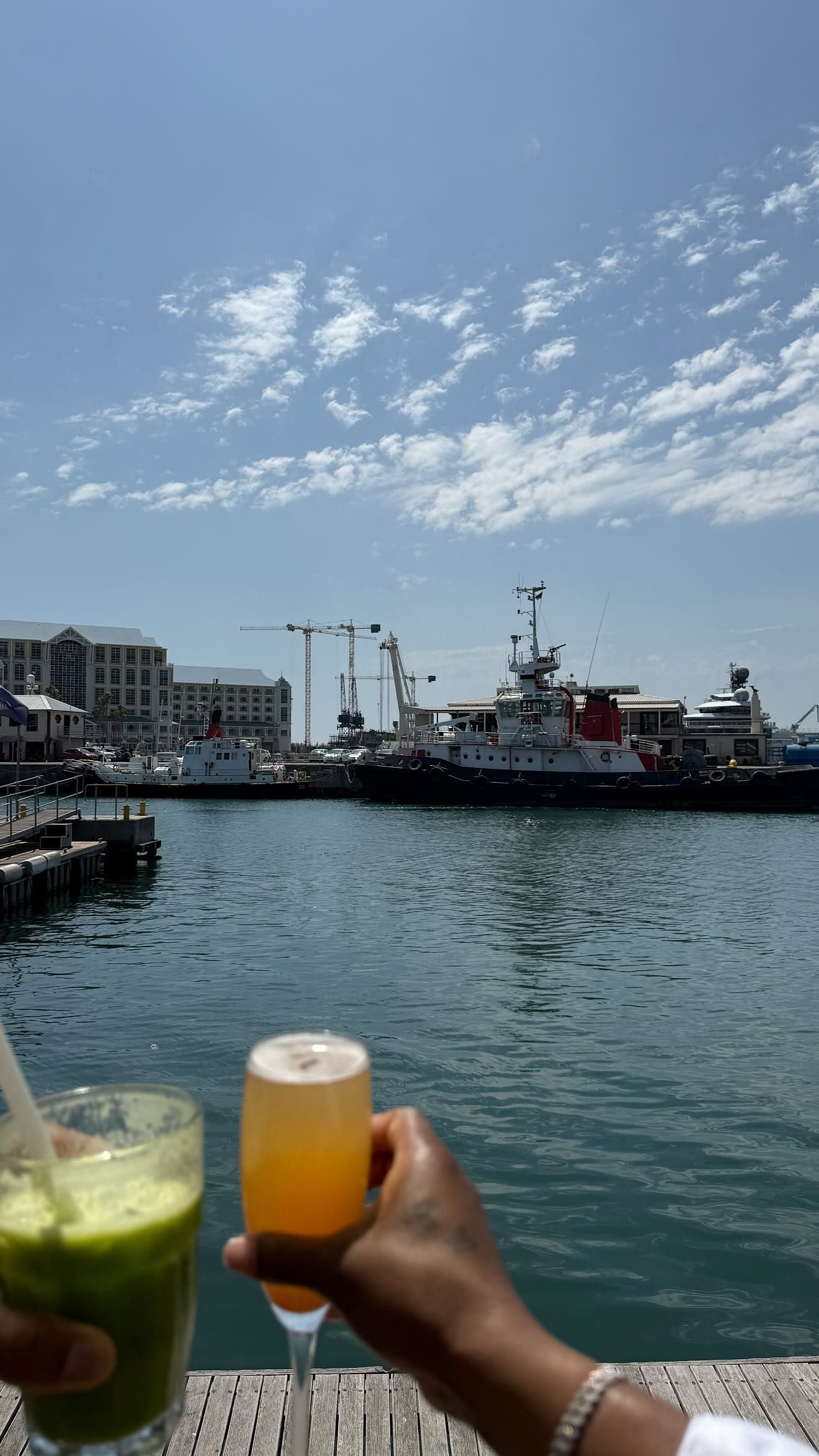 Jonathan Owens and Simone Biles enjoy drinks while admiring Cape Town&#039;s harbor