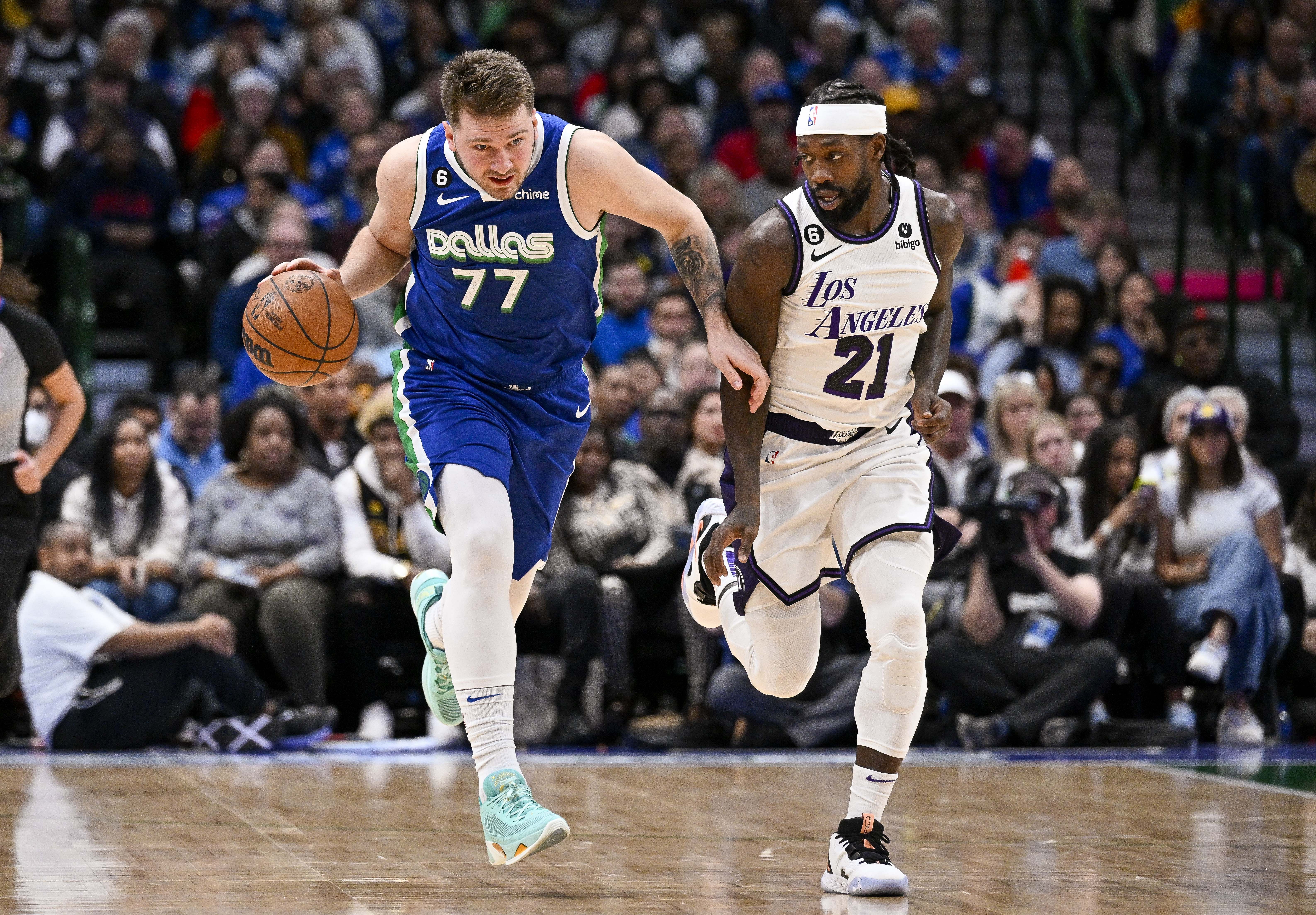 Former Dallas Mavericks guard Luka Doncic and Los Angeles Lakers guard Patrick Beverley in action during an NBA game. (Credit: IMAGN)