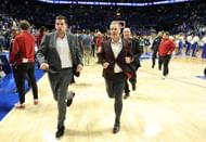 College Basketball: <a href='https://www.sportskeeda.com/basketball/john-calipari' target='_blank' rel='noopener noreferrer'>John Calipari</a> the head coach of the Arkansa <a href='https://www.sportskeeda.com/college-basketball/arkansas-razorbacks' target='_blank' rel='noopener noreferrer'>Razorbacks</a> runs off of the court following the 89-79 win over the Kentucky Wildcats at Rupp Arena - Source: Getty