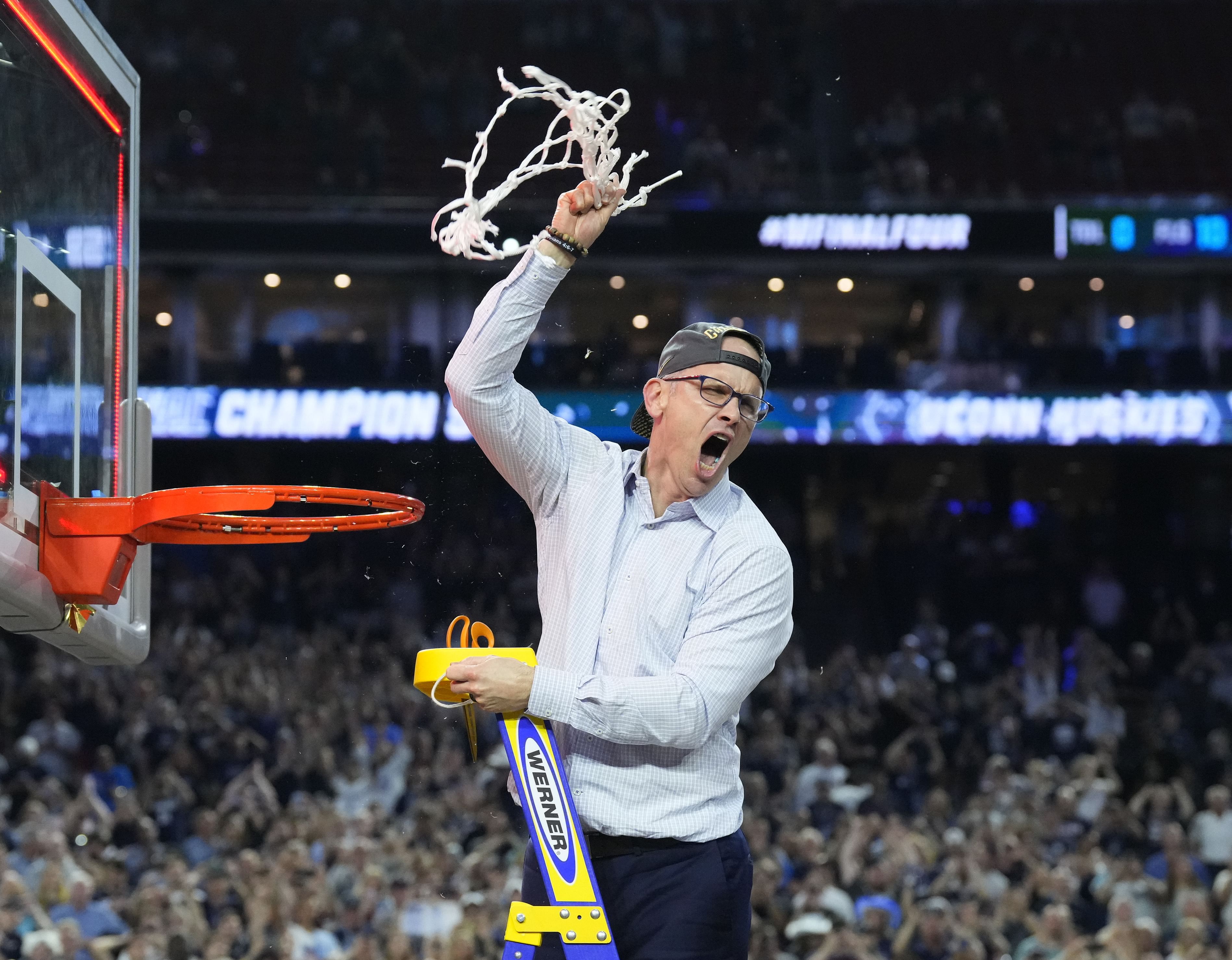 UConn Huskies head coach Dan Hurley cuts down the net after defeating the San Diego State Aztecs in the national championship game of the 2023 NCAA Tournament at NRG Stadium (Credits: IMAGN)