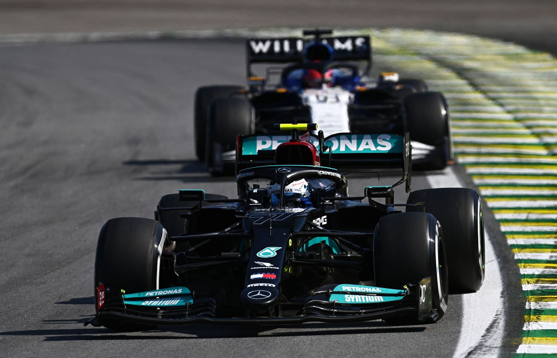 Valtteri Bottas driving the (77) Mercedes W12 leads George Russell driving the (63) Williams Racing FW43B during the F1 Grand Prix of Brazil - Source: Getty