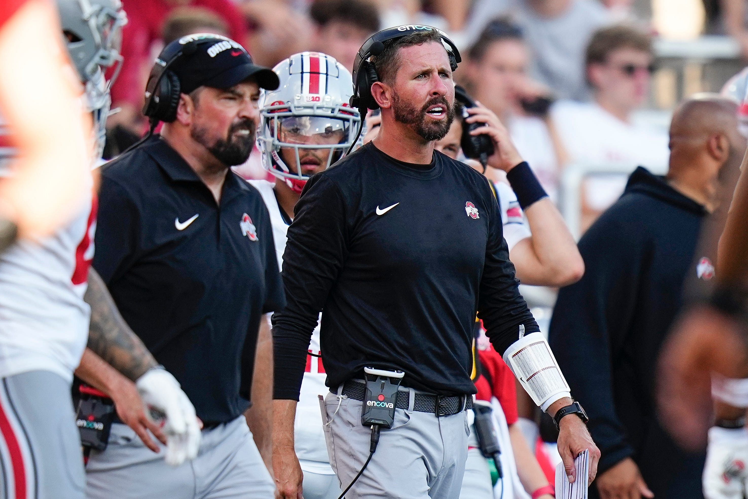 Sep 2, 2023; Bloomington, Indiana, USA; Ohio State Buckeyes head coach Ryan Day and offensive coordinator Brian Hartline yell from the sideline during the NCAA football game at Indiana University Memorial Stadium. - Source: Imagn