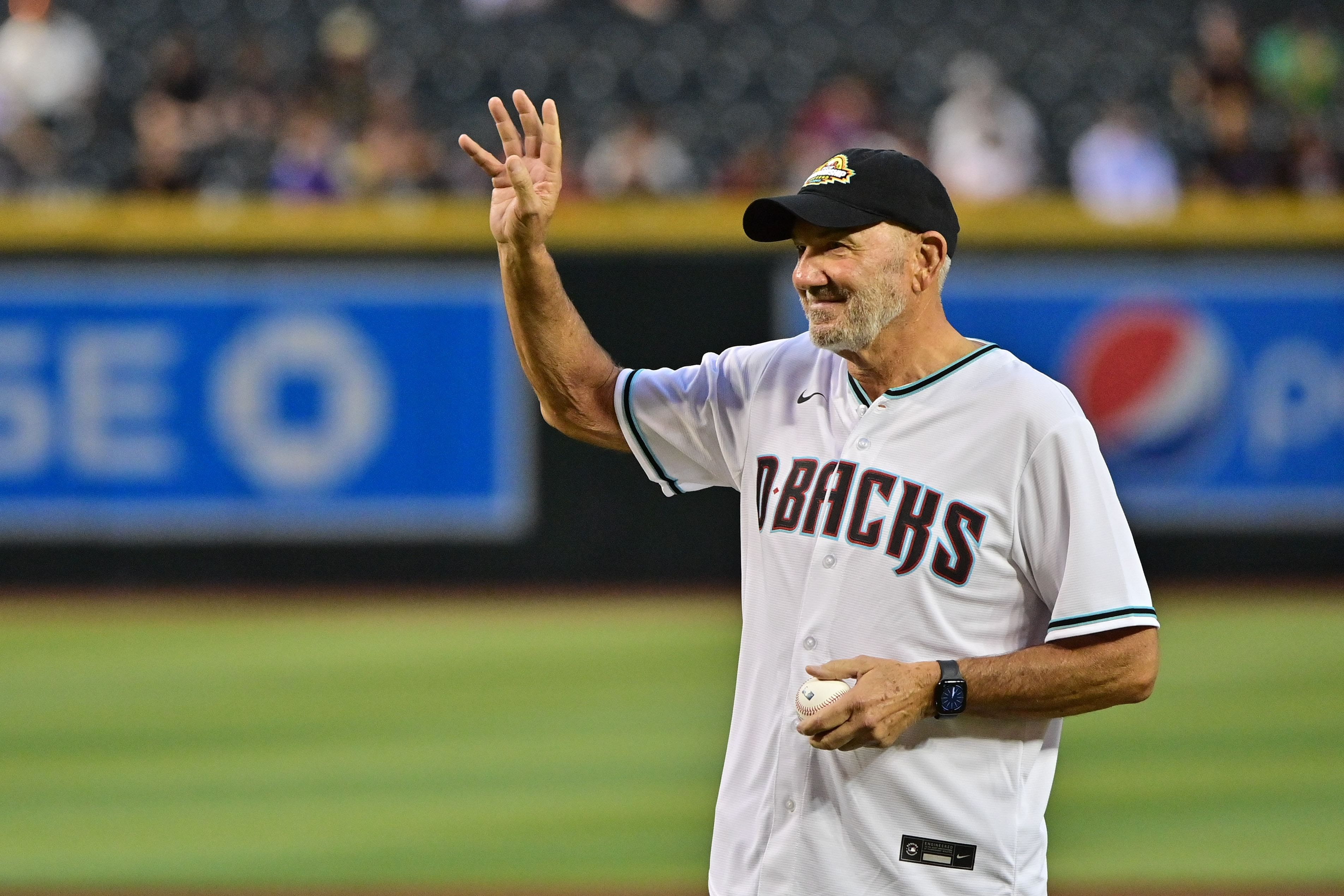 NASCAR driver Dale Jarrett throws out the first pitch prior to the game between the Arizona Diamondbacks and the San Francisco Giants at Chase Field - Source: Imagn