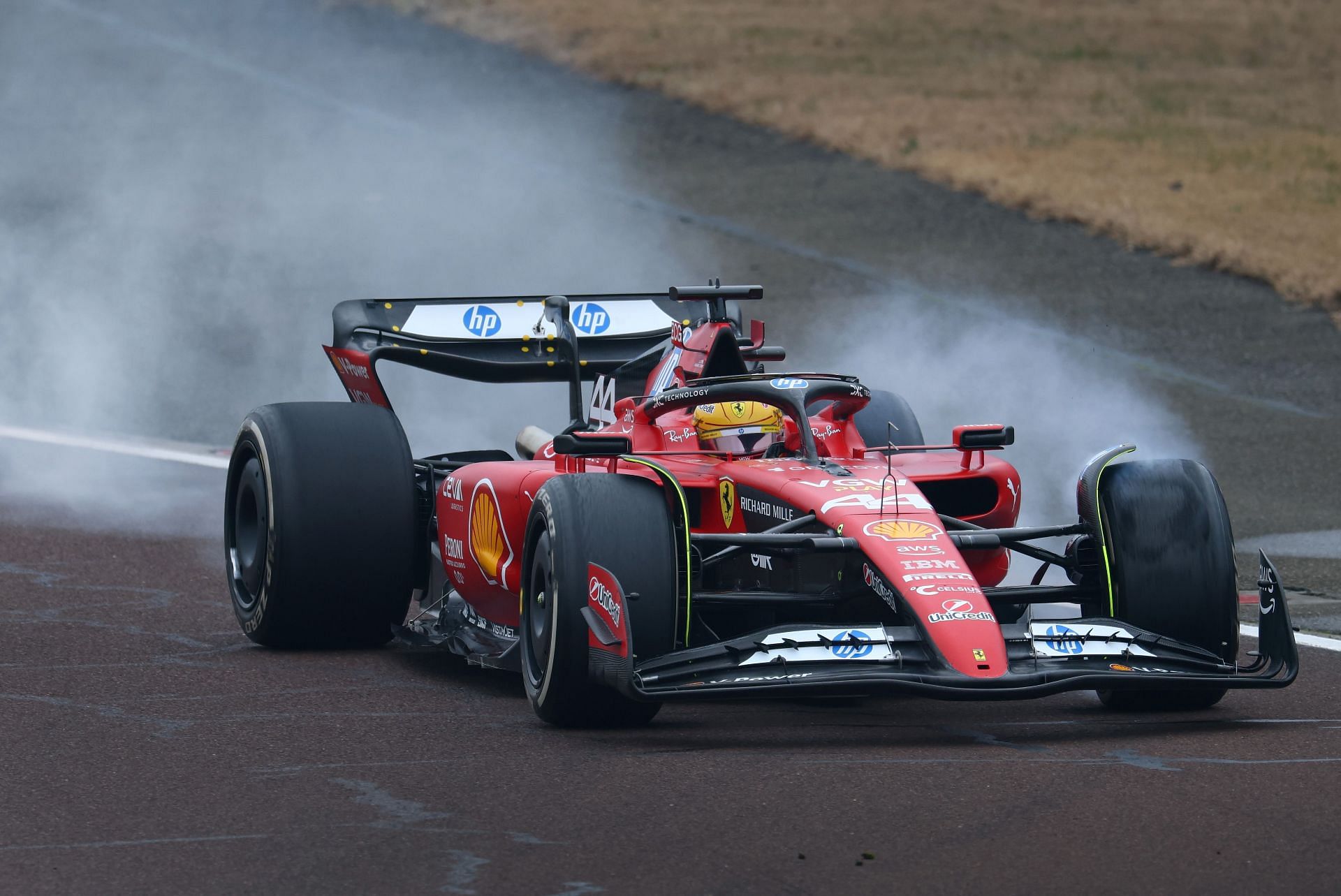 Lewis Hamilton locks a wheel under braking during his first official days as a Scuderia Ferrari F1 driver at Fiorano Circuit on January 22, 2025 - Source: Getty