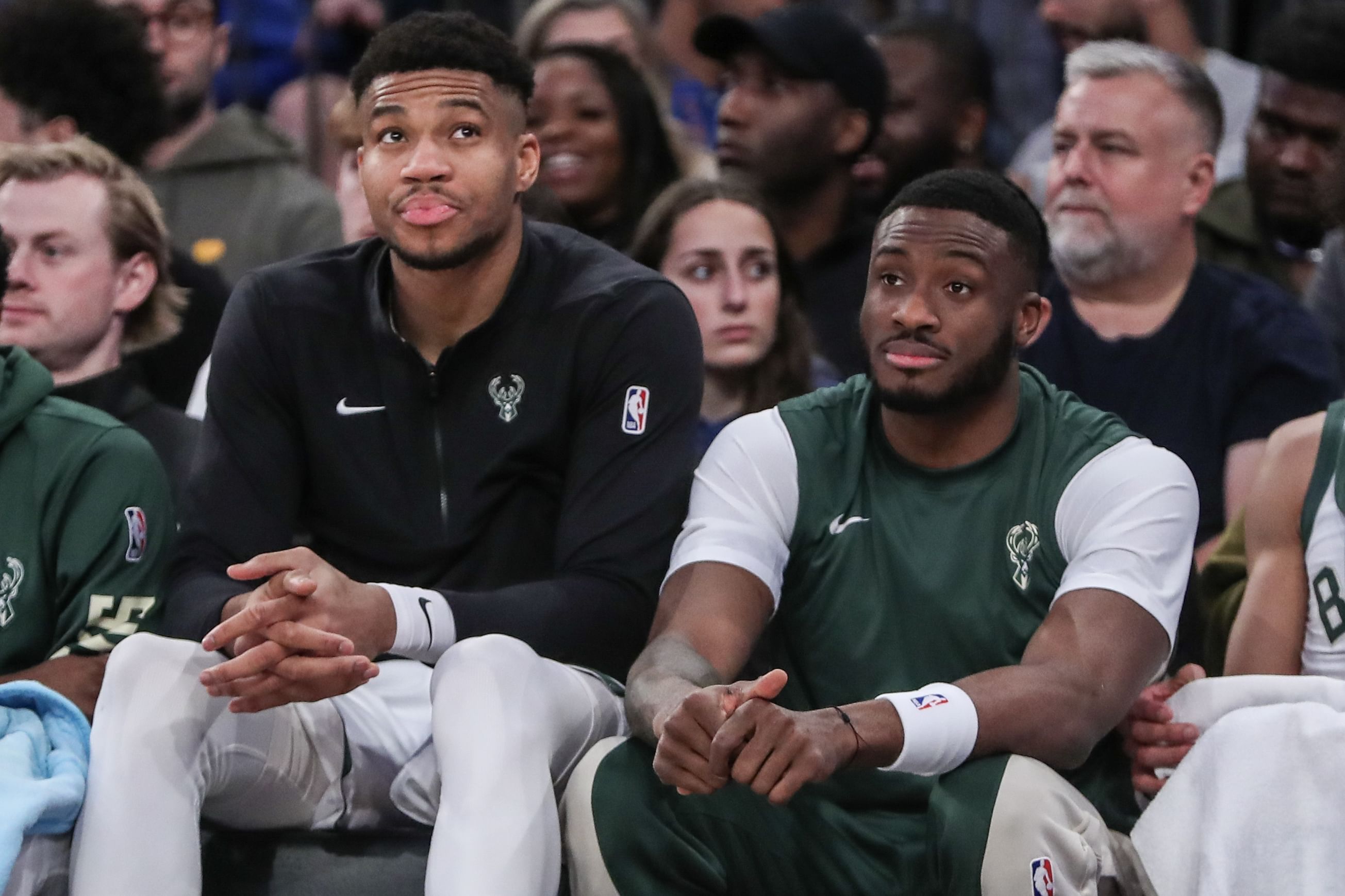 Milwaukee Bucks forward Giannis Antetokounmpo (l) and his brother Thanasis Antetokounmpo (r) watch a game at Madison Square Garden. Photo Credit: Imagn