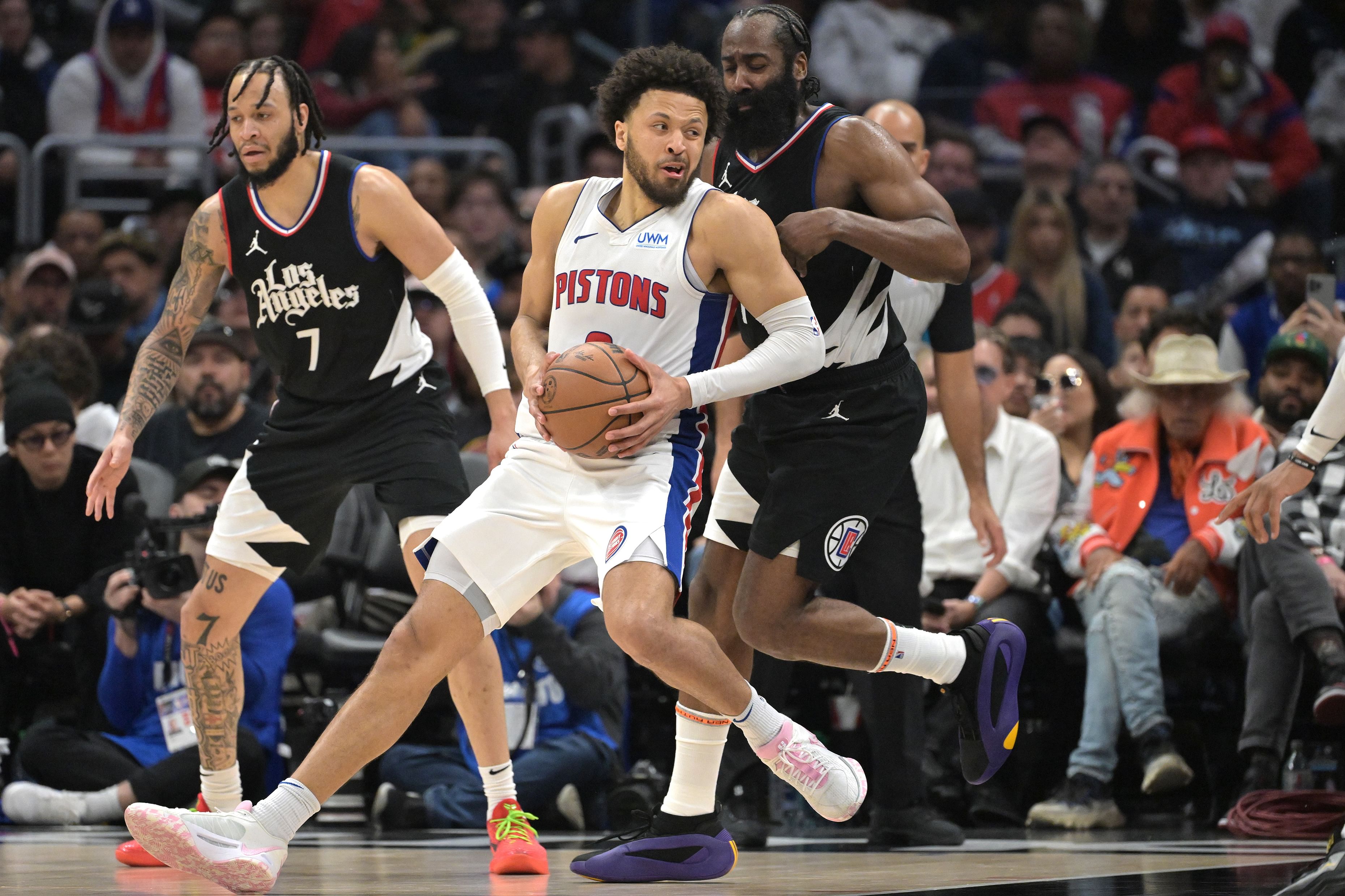 Feb 10, 2024; Los Angeles, California, USA; Detroit Pistons guard Cade Cunningham (2) is defended by Los Angeles Clippers guard James Harden (1) in the second half at Crypto.com Arena. Mandatory Credit: Jayne Kamin-Oncea-Imagn Images - Source: Imagn