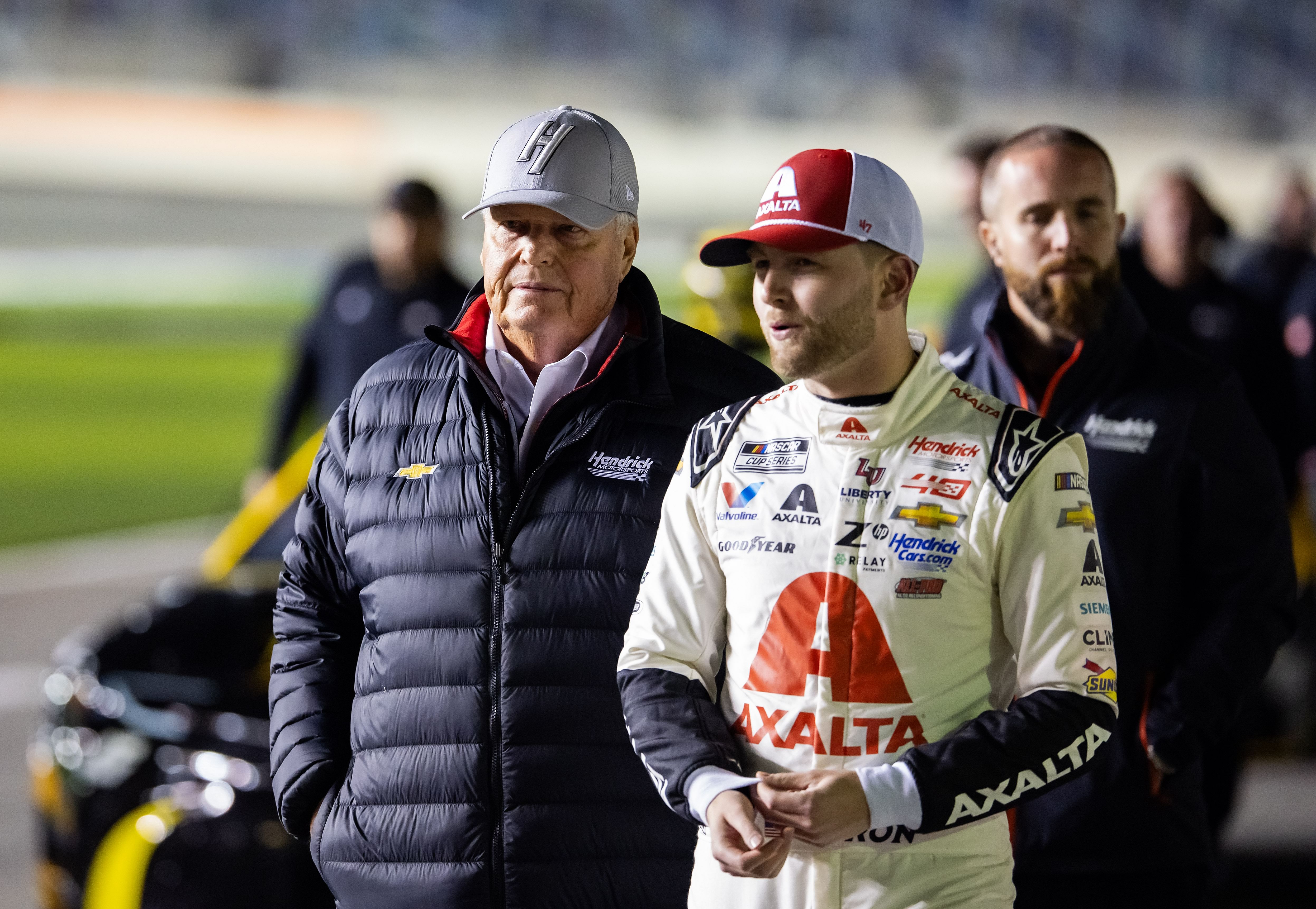 William Byron (24) and Rick Hendrick (left) walk on pit row during qualifying for the Daytona 500 - Source: Imagn