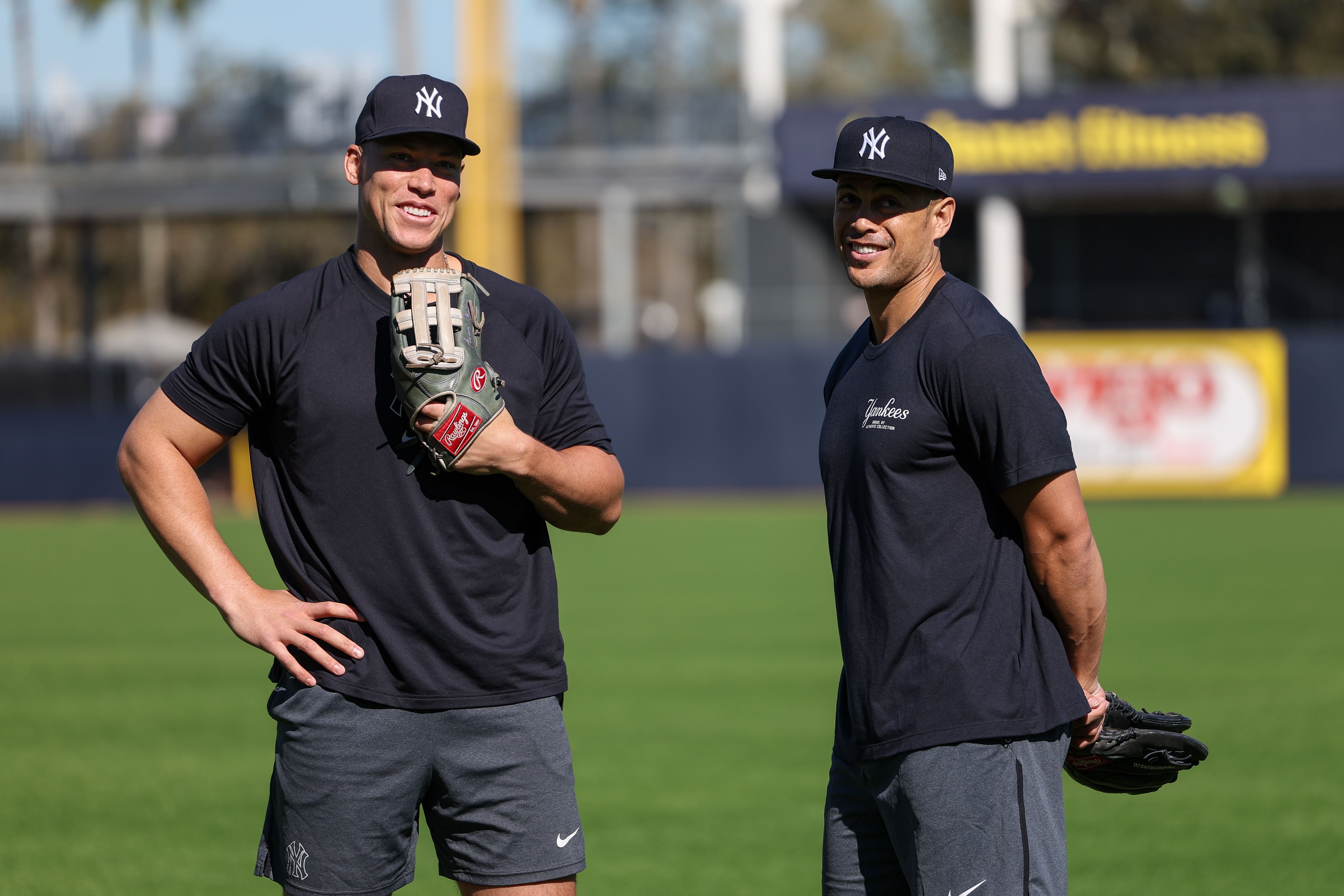 Feb 19, 2024; Tampa, FL, USA; New York Yankees right fielder Aaron Judge (99) and outfielder Giancarlo Stanton (27) participate in spring training workouts at George M. Steinbrenner Field. Mandatory Credit: Nathan Ray Seebeck-Imagn Images - Source: Imagn