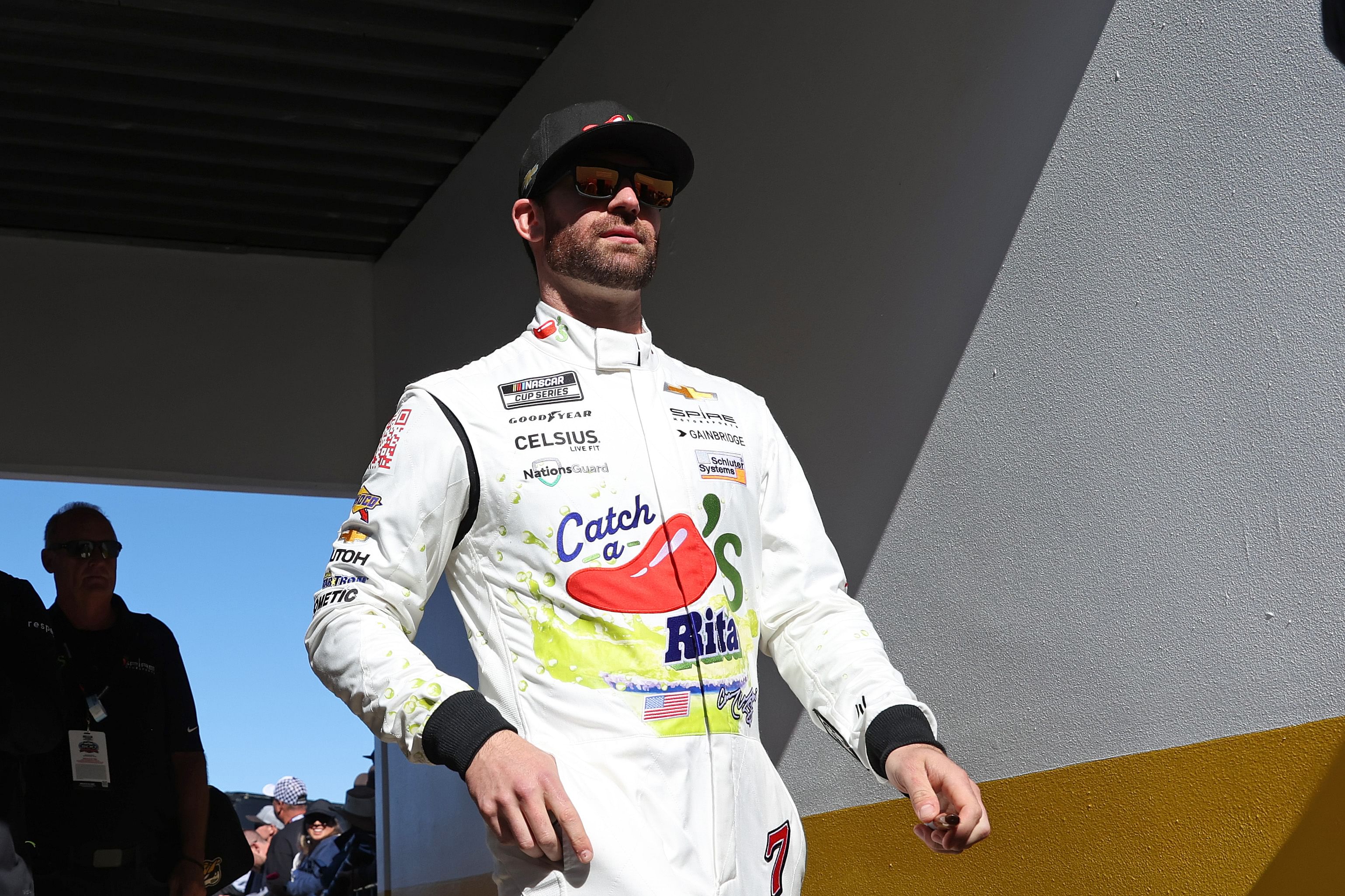 Corey LaJoie walks to drivers introductions before the Daytona 500 at Daytona International Speedway - Source: Imagn