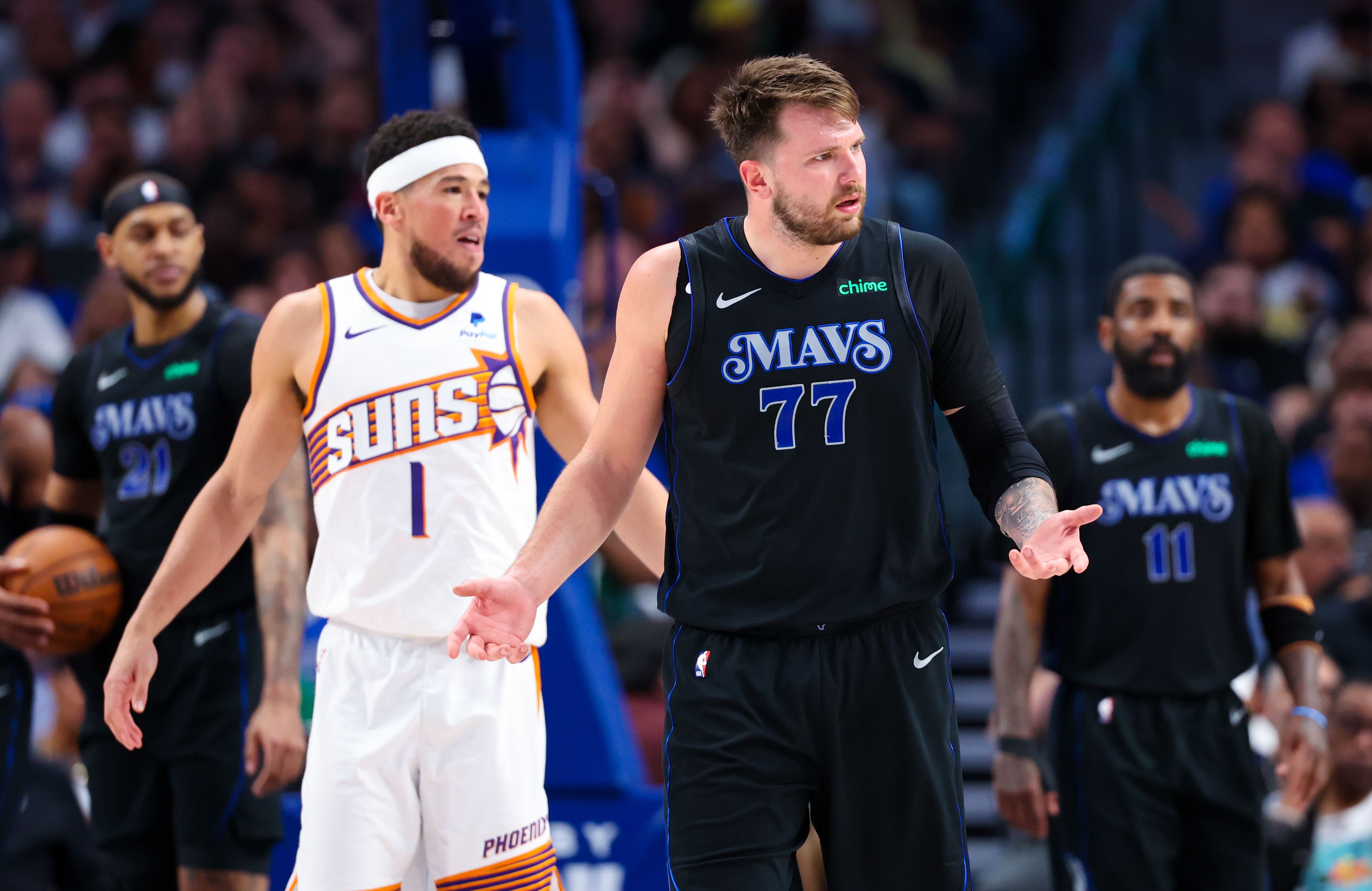 Dallas Mavericks guard Luka Doncic reacts in front of Phoenix Suns guard Devin Booker at American Airlines Center. Photo Credit: Imagn