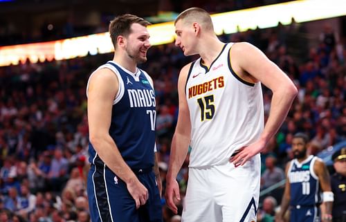 Dallas Mavericks guard Luka Doncic speaks with Denver Nuggets center Nikola Jokic at American Airlines Center. Photo Credit: Imagn