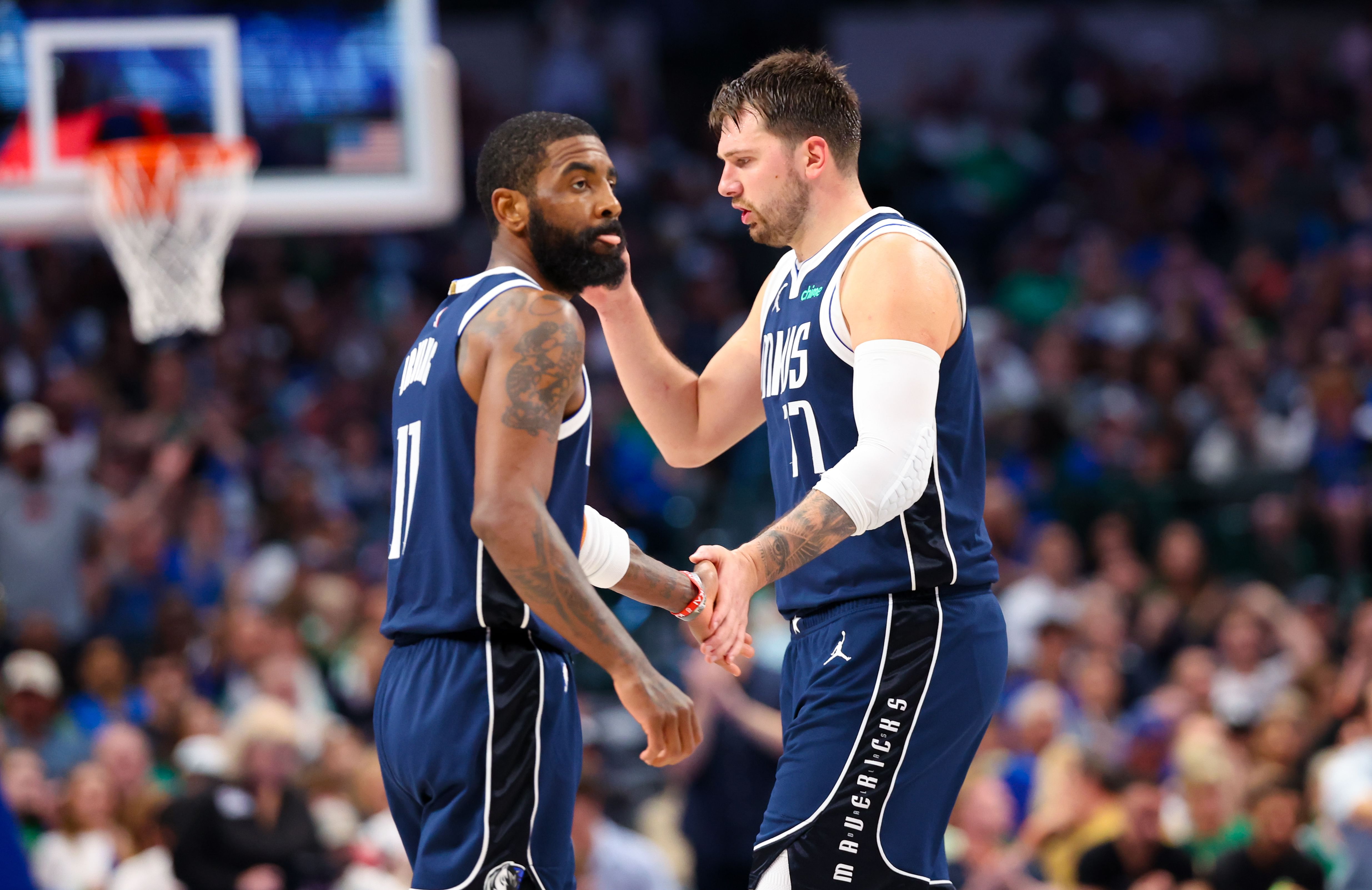 Dallas Mavericks guard Kyrie Irving celebrates with Dallas Mavericks guard Luka Doncic against the Denver Nuggets at American Airlines Center. Photo Credit: Imagn