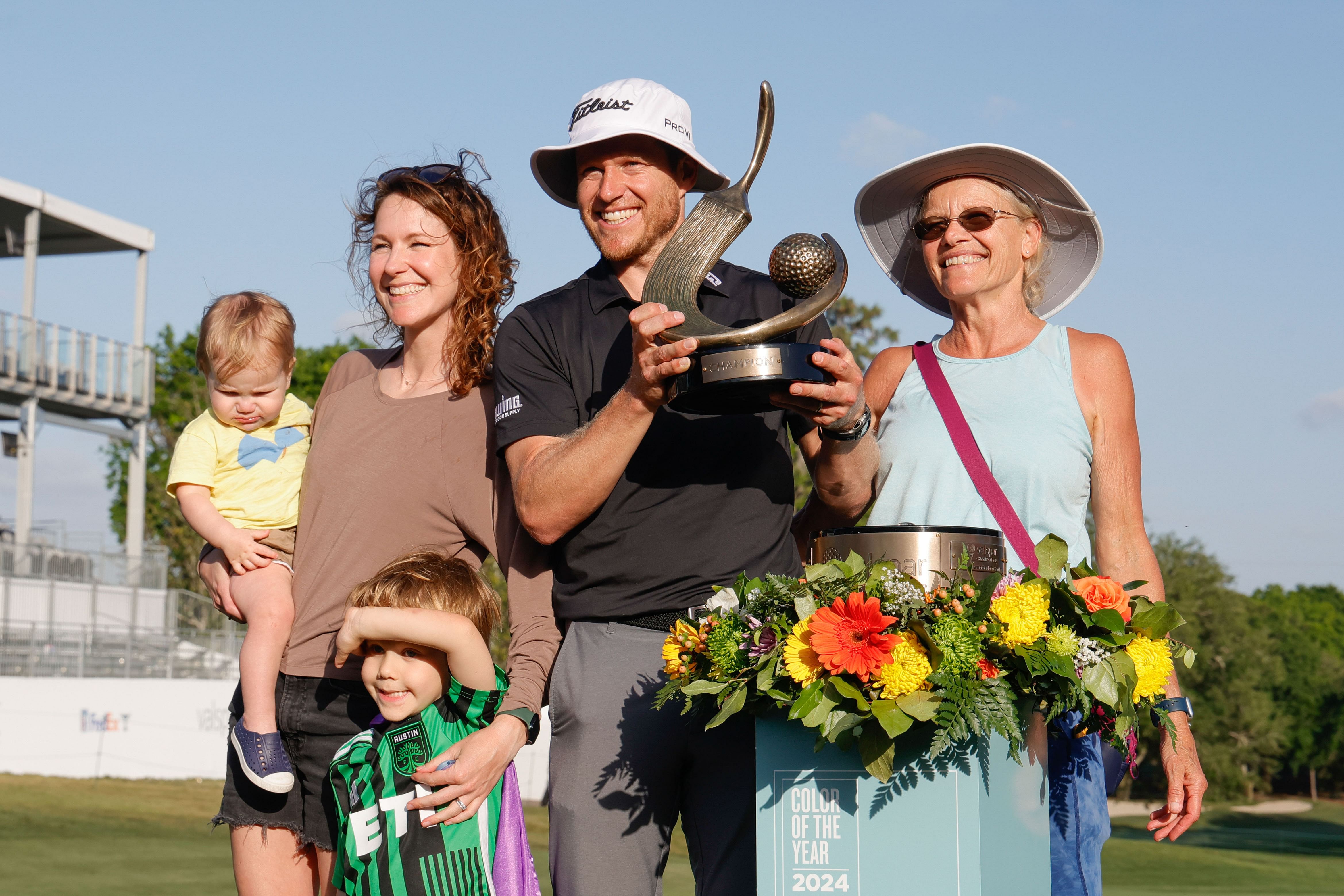 Mar 24, 2024; Palm Harbor, Florida, USA; Peter Malnati, right center, and his wife Alicia, left center and mother Donna Malnati, right, and son Hatcher, Bottom, and son Dash all celebrate Peters victory at the Valspar Championship golf tournament. Mandatory Credit: Reinhold Matay-Imagn Images - Source: Imagn