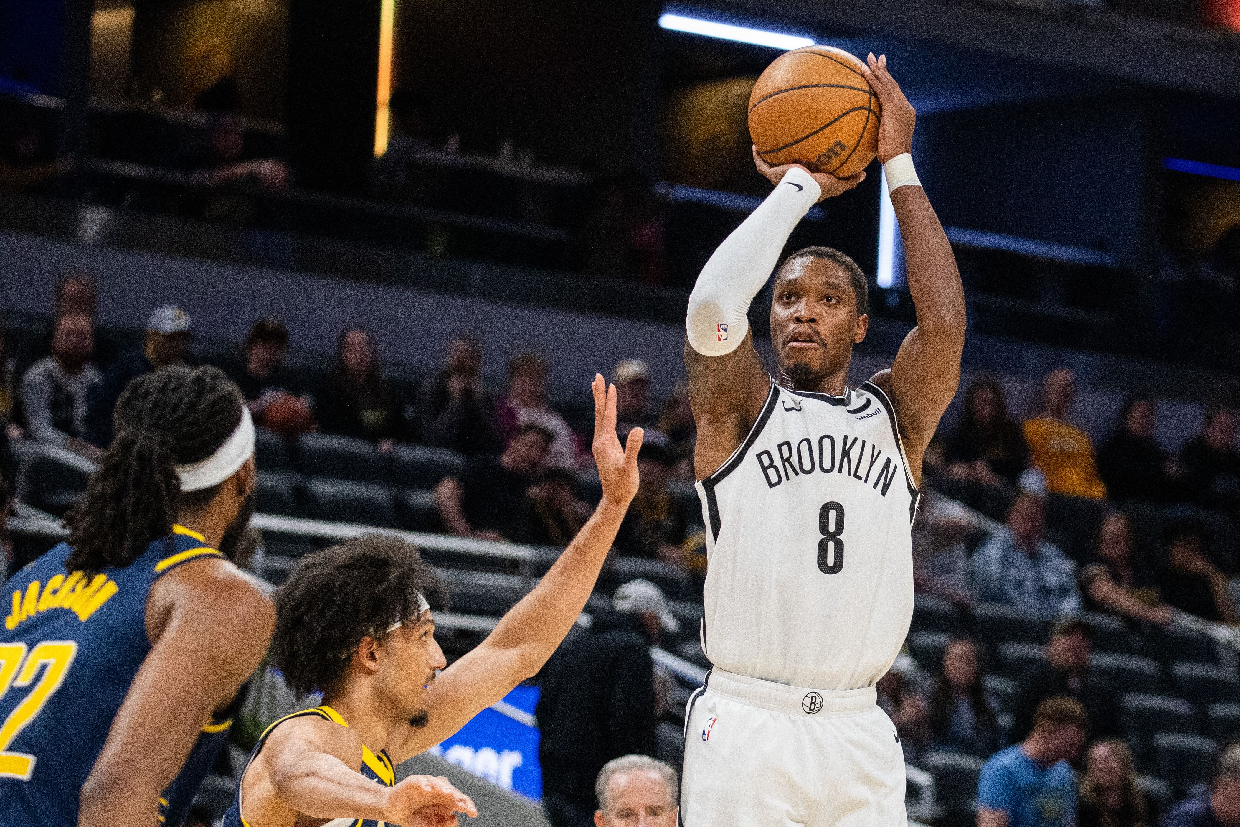 Apr 1, 2024; Indianapolis, Indiana, USA; Brooklyn Nets guard Lonnie Walker IV (8) shoots the ball while Indiana Pacers guard Kendall Brown (10) defends in the second half at Gainbridge Fieldhouse. Mandatory Credit: Trevor Ruszkowski-Imagn Images - Source: Imagn