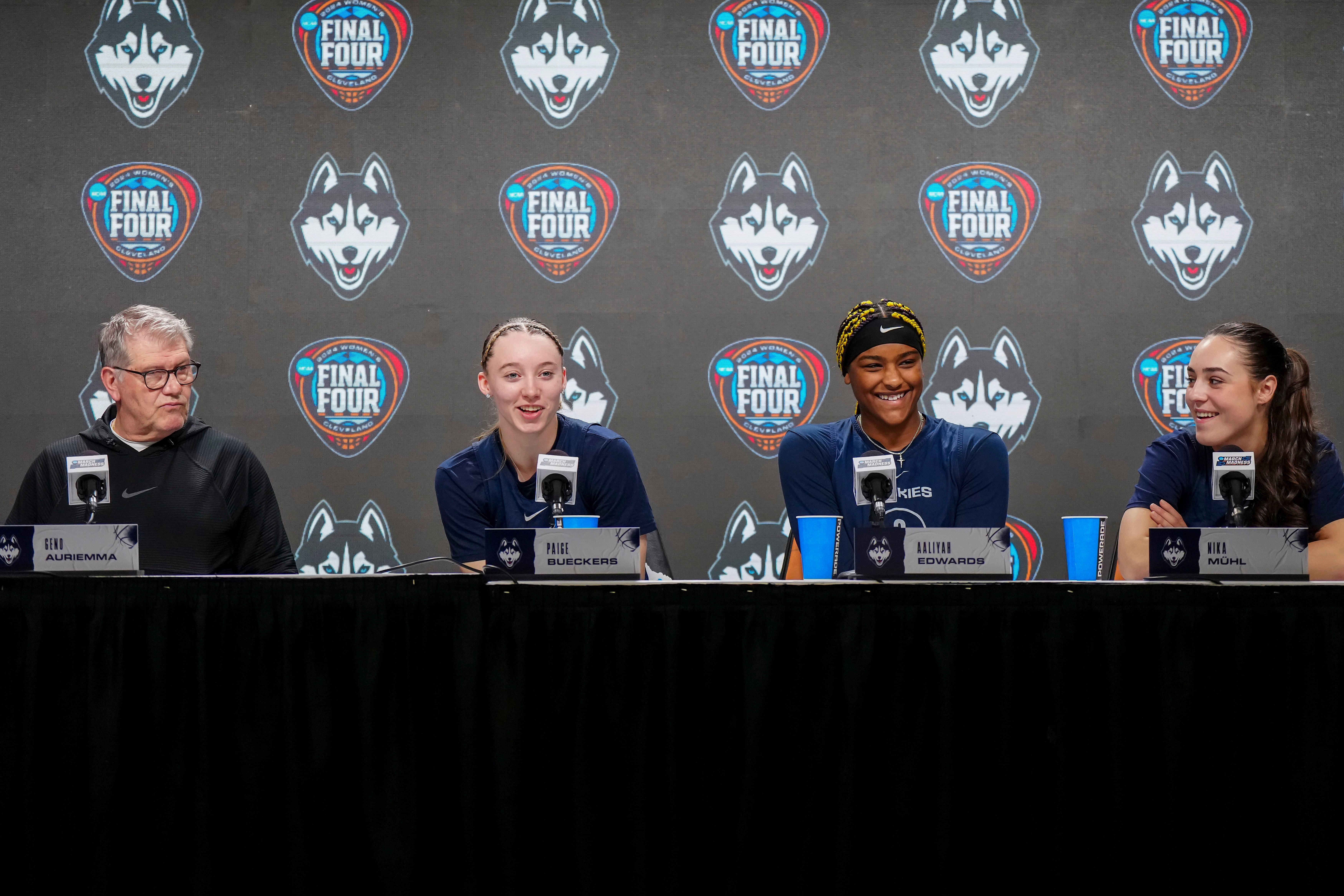 (From left: Geno Auriemma, Paige Bueckers, Aaliyah Edwards and Nika Muhl), UConn team talks to the press after 2024 Final Four practice before facing Iowa. - Source: Imagn