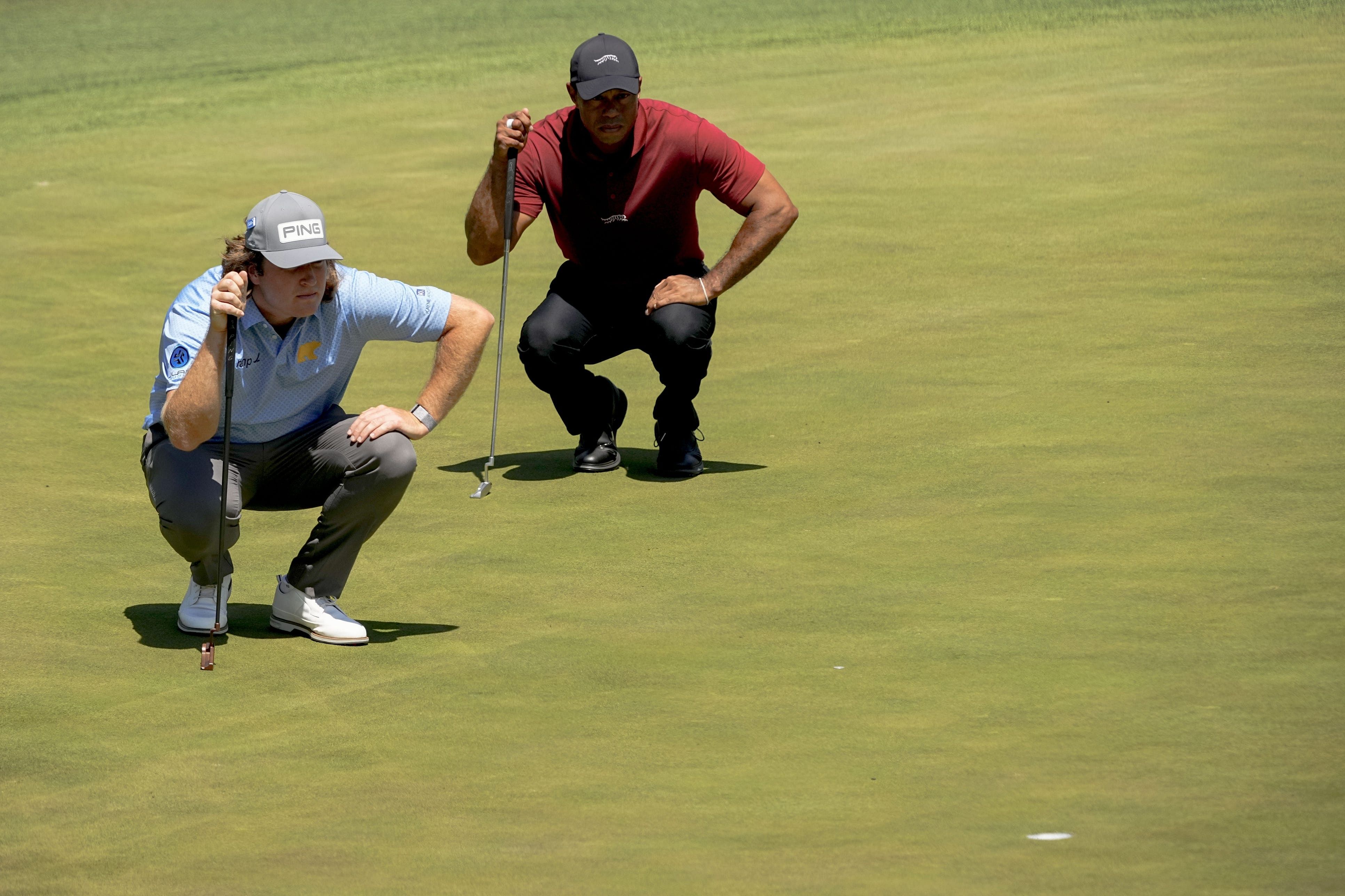 Neal Shipley and Tiger Woods line up their putts on the No. 15 green during the final round of the Masters Tournament - Source: Imagn