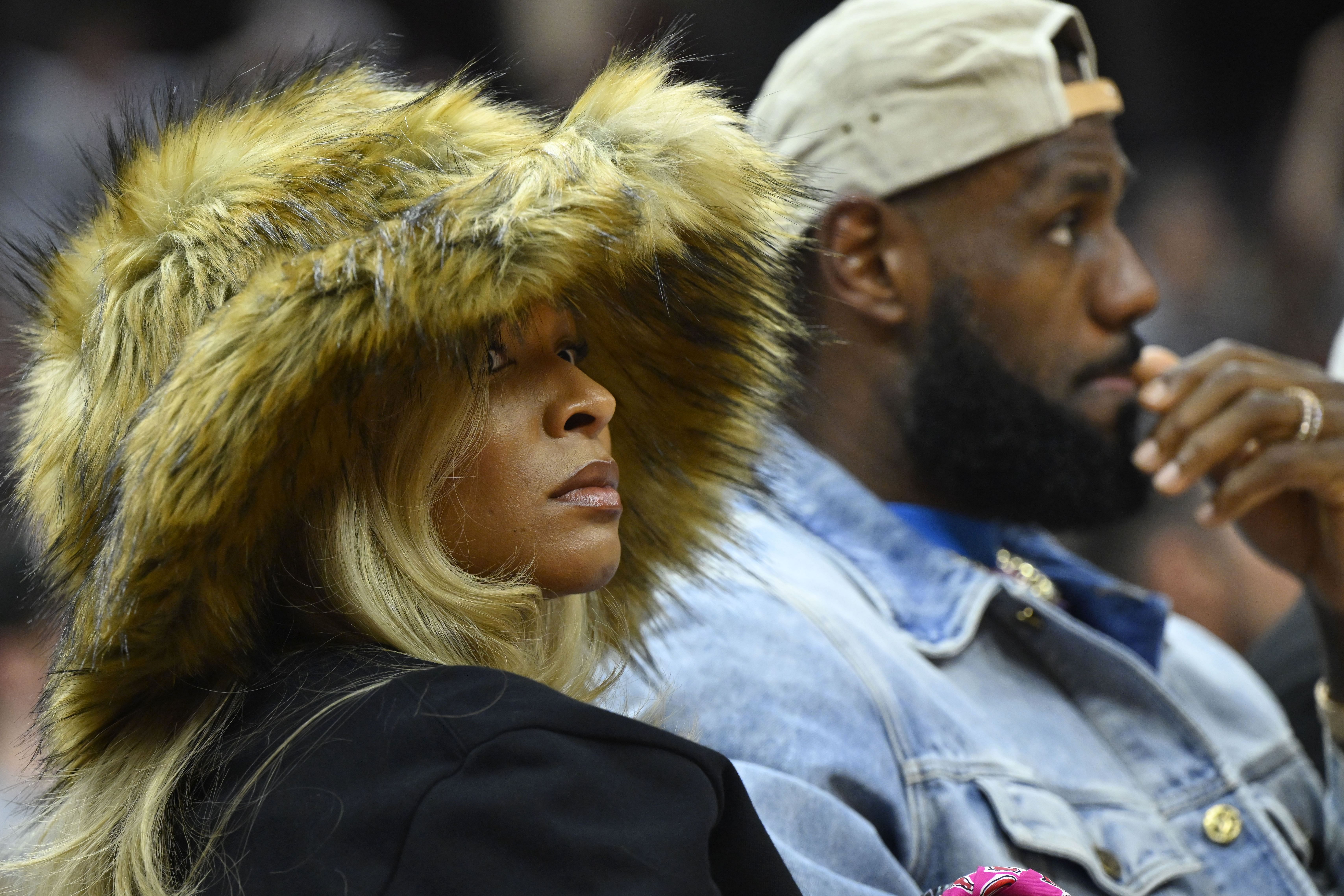 Los Angeles Lakers forward LeBron James and his wife Savannah James watch a game at Rocket Mortgage FieldHouse. Photo Credit: Imagn