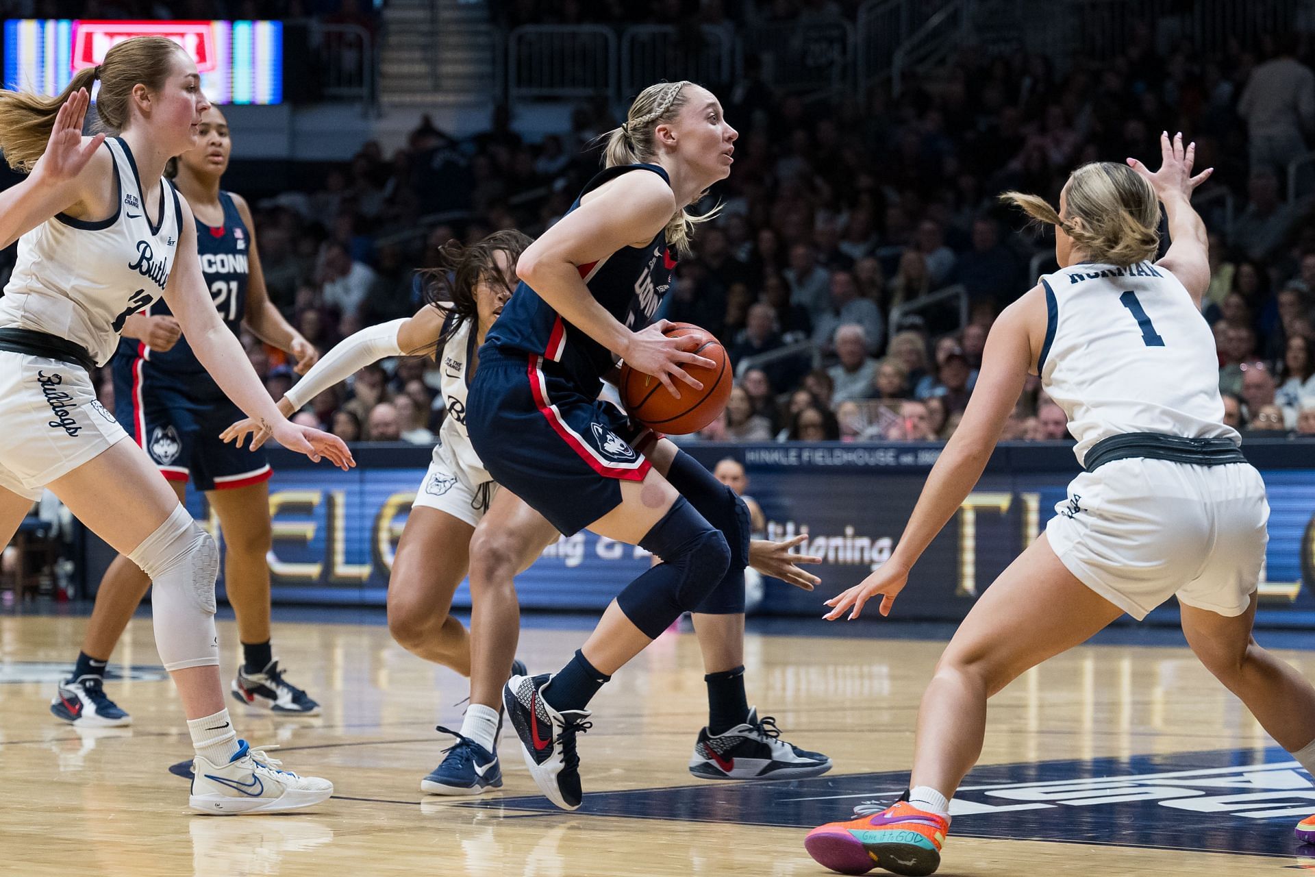 UConn Huskies guard Paige Bueckers (#5) drives into the lane against Butler Bulldogs guard Karsyn Norman (#1) during their game at Hinkle Fieldhouse. Photo: Getty