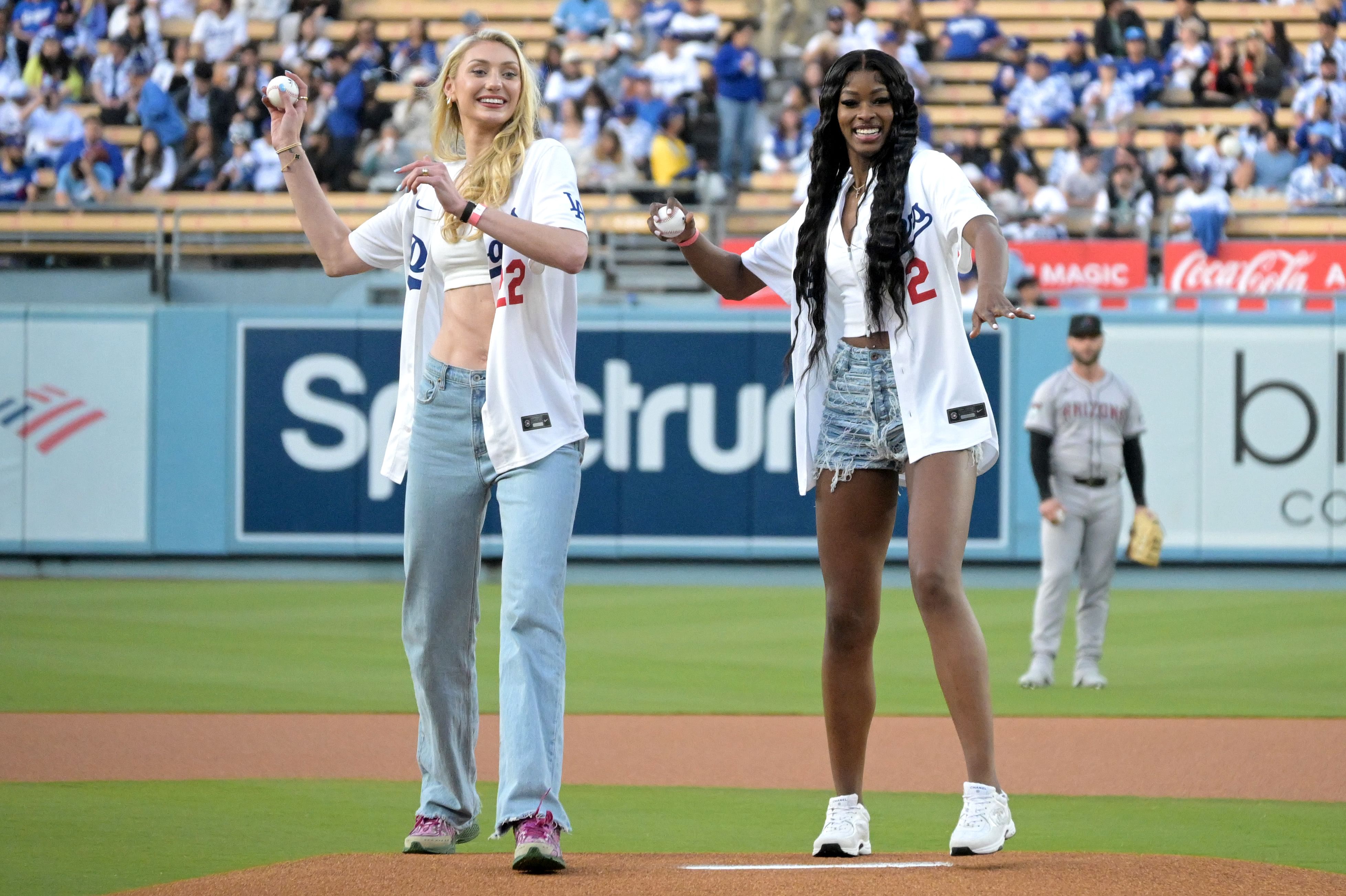 Los Angeles Sparks Cameron Brink and Rickea Jackson throw out the first pitch at Dodger Stadium. Photo Credit: Imagn