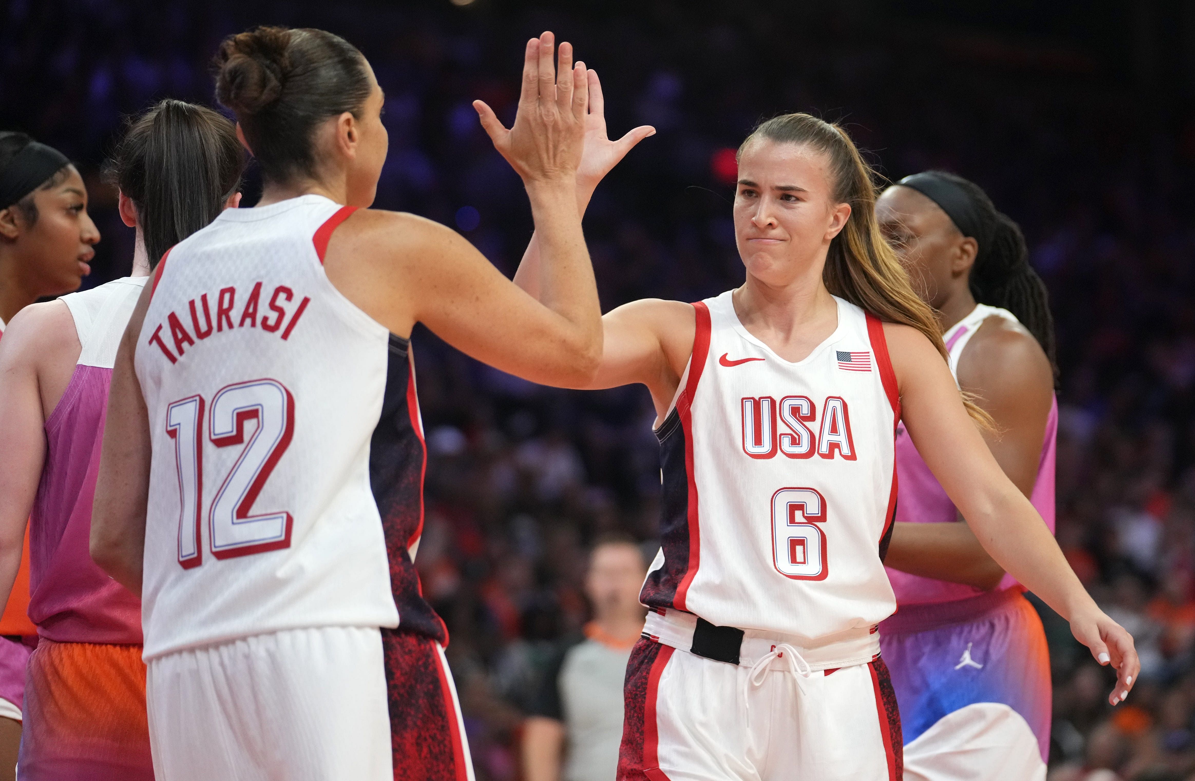 Team USA guard Sabrina Ionescu (6) high-fives teammate Diana Taurasi (12) as they play against Team WNBA in the WNBA All-Star Game at Footprint Center in Phoenix on July 20, 2024. - Source: Imagn