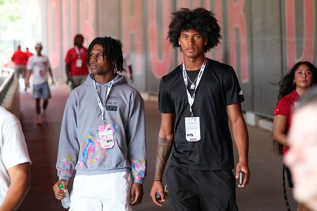 Aug 31, 2024; Columbus, OH, USA; Ohio State Buckeyes recruits Kayden Dixon-Wyatt and Chris Henry Jr. walk onto the field prior to the NCAA football game against the Akron Zips at Ohio Stadium. Ohio State won 52-6. - Source: Imagn