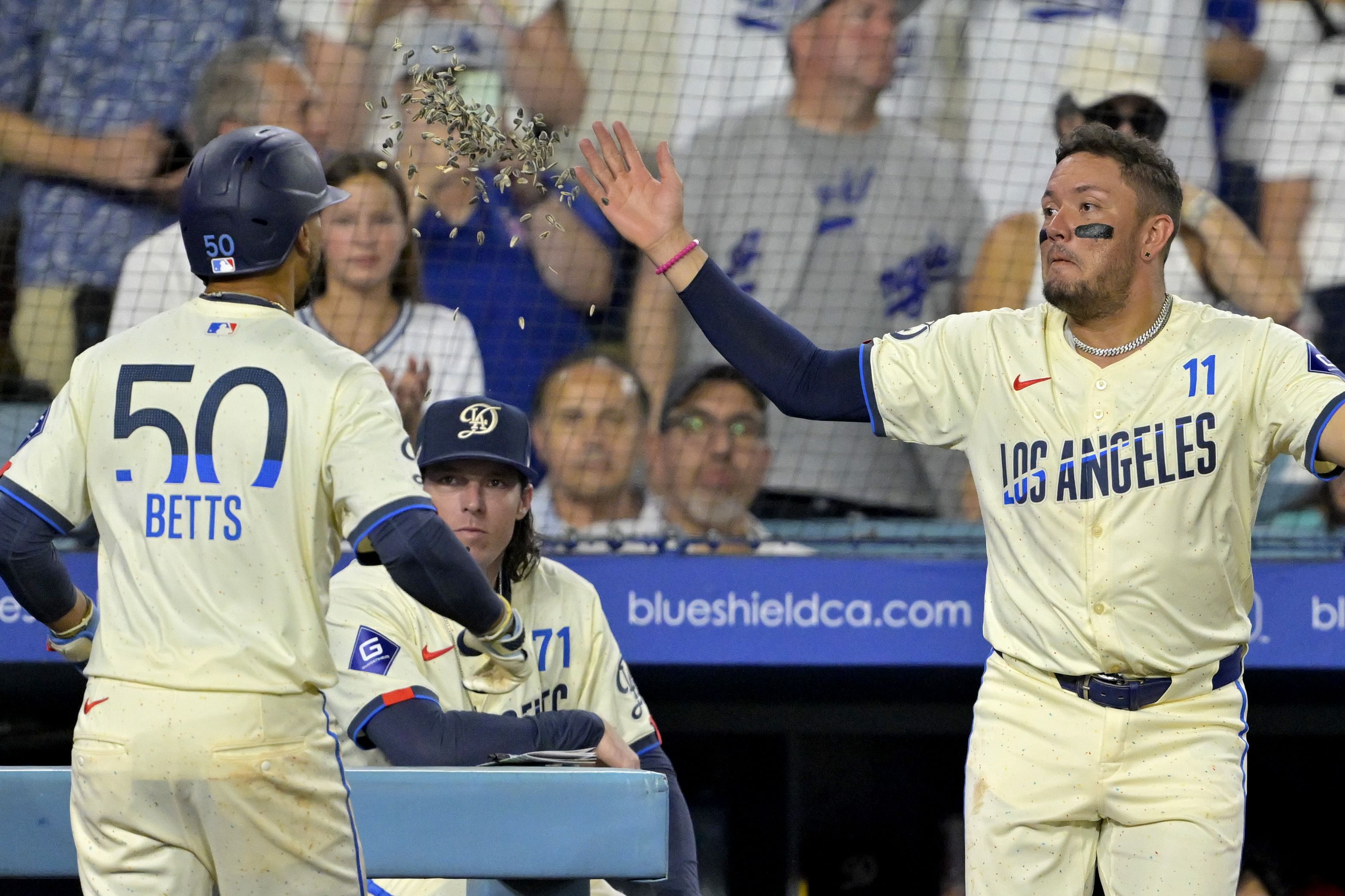 Miguel Rojas and Mookie Betts both played over 50 games at shortstop for the Dodgers last year (Image Source: IMAGN)