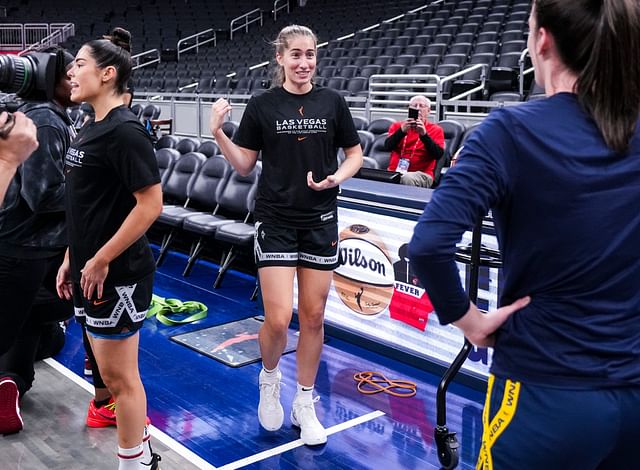 Former Iowa Hawkeyes Las Vegas Aces guard Kate Martin (20) and Indiana Fever guard Caitlin Clark (22) reunite Wednesday, Sept. 11, 2024, during a game between the Indiana Fever and the Las Vegas Aces at Gainbridge Fieldhouse in Indianapolis. - Source: Imagn