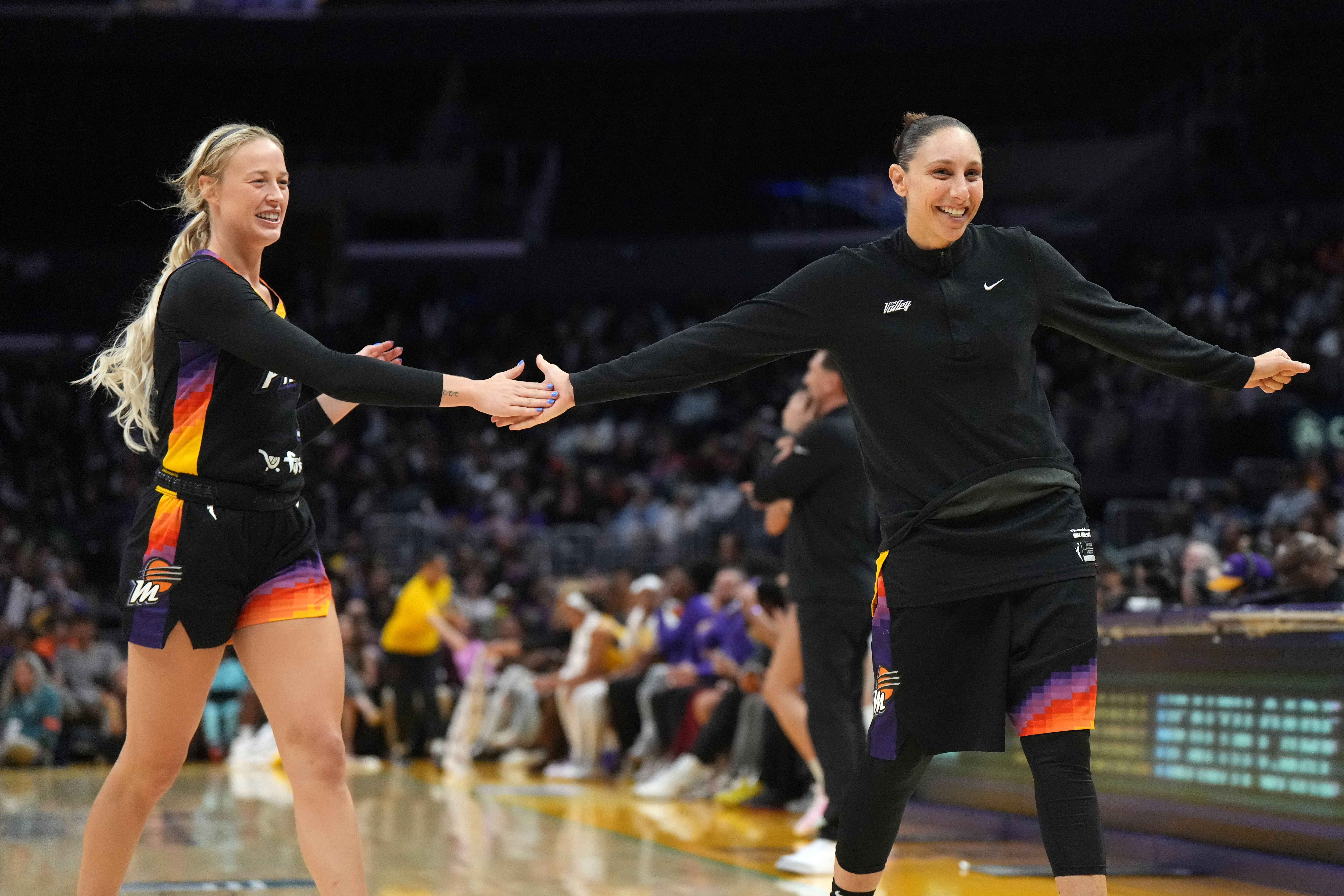 Sep 17, 2024; Los Angeles, California, USA; Phoenix Mercury guard Sophie Cunningham (9) and guard Diana Taurasi (3) celebrate in the second half against the LA Sparks at Crypto.com Arena. Mandatory Credit: Kirby Lee-Imagn Images - Source: Imagn