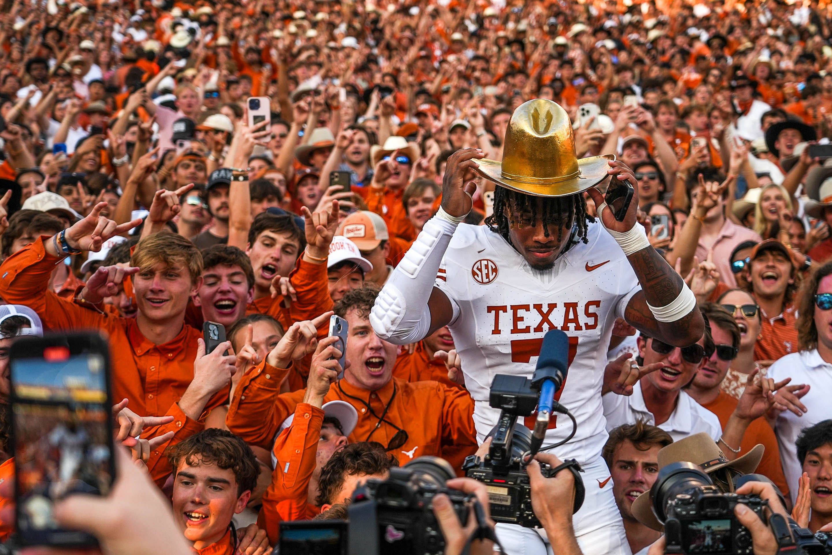 Texas Longhorns defensive back Jahae Barron (7) wears the Golden Hat Trophy in the fan section after the 34-3 win against Oklahoma in the Red River Rivalry game at the Cotton Bowl on Saturday, Oct. 12, 2024 in Dallas, Texas. - Source: Imagn