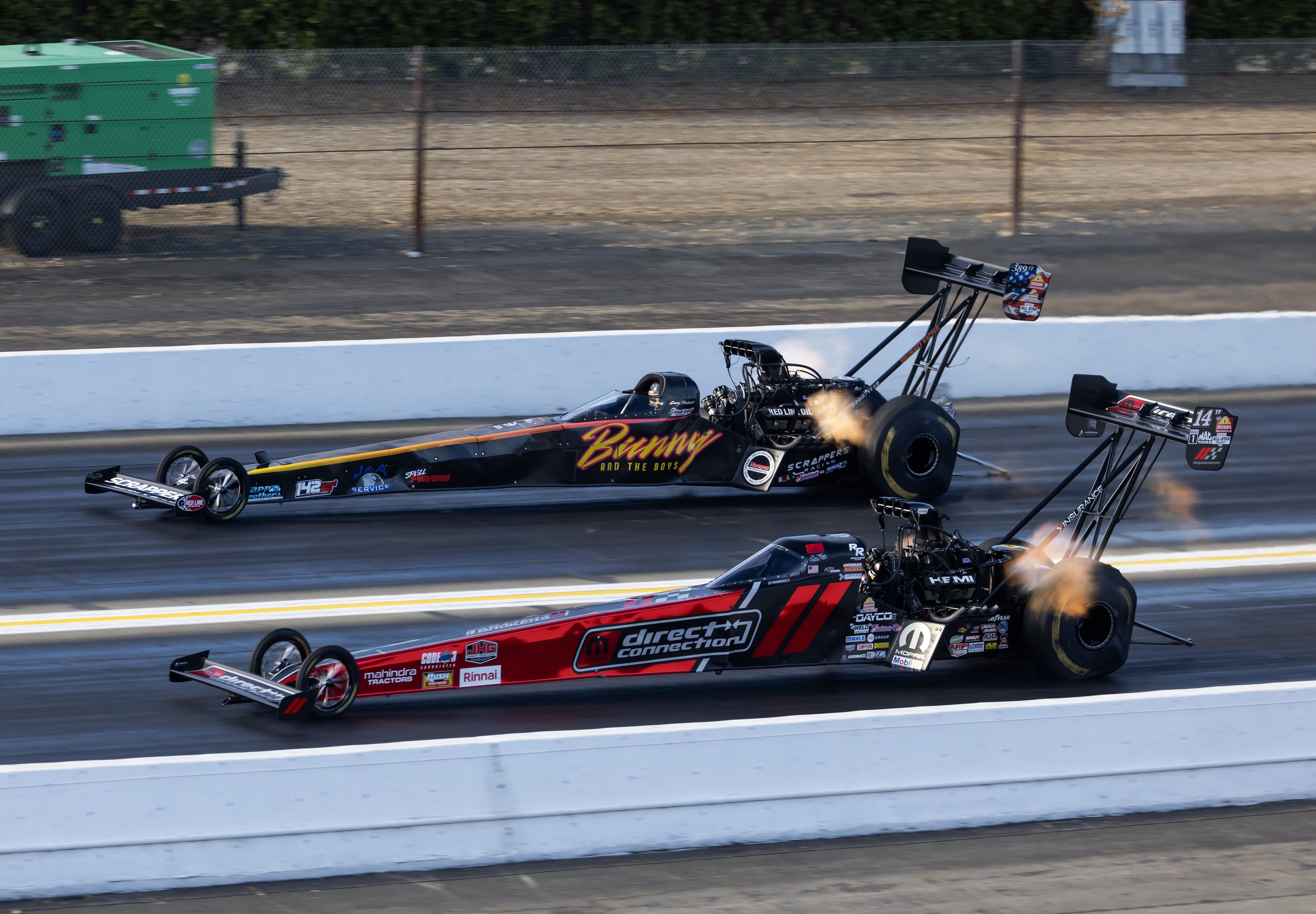 Tony Stewart (near) races alongside Gary Pritchett during the NHRA Finals at In-N-Out Burger Pomona Dragstrip- Source: Imagn