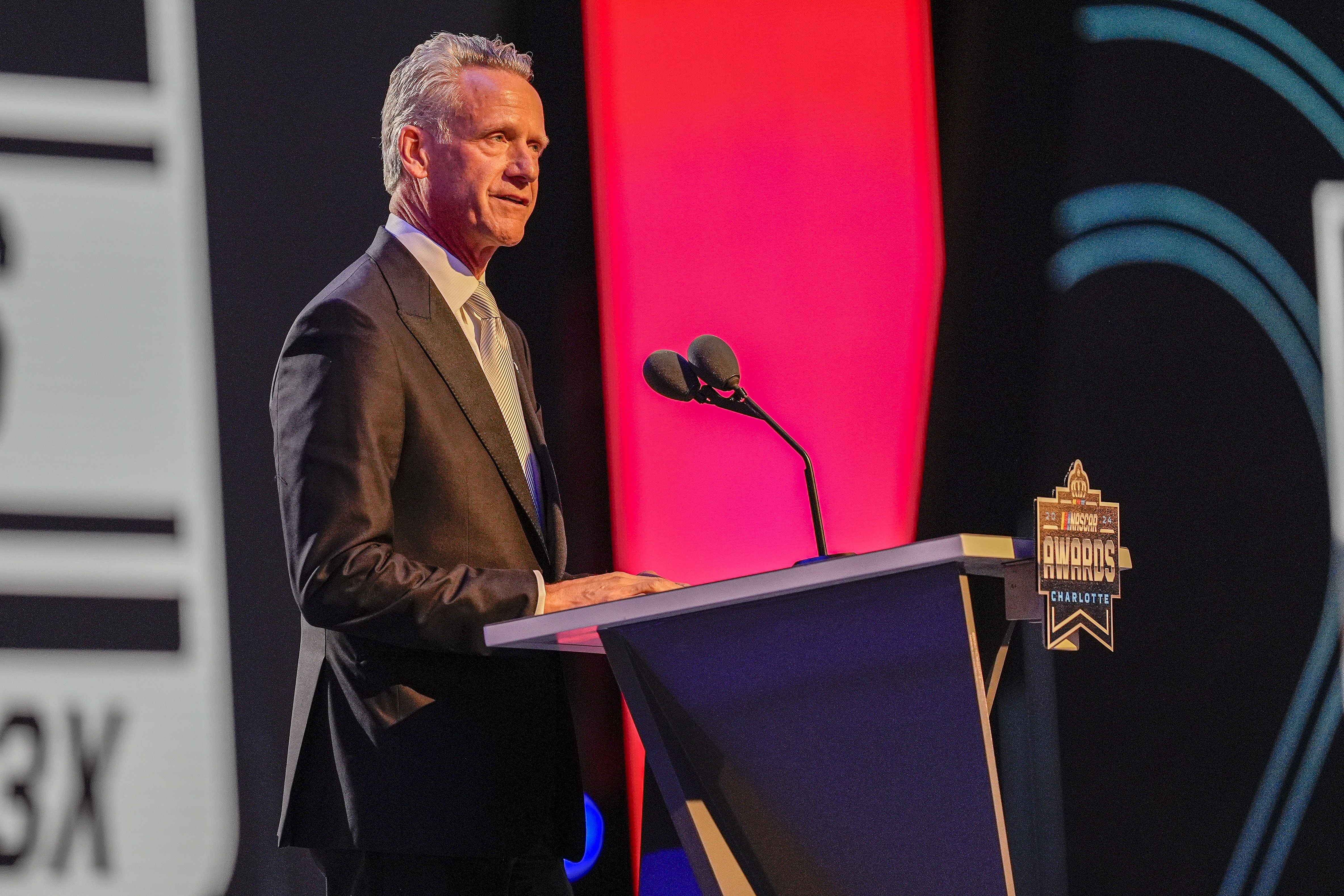 NASCAR President Steve Phelps speaks during the NASCAR Awards Banquet at Charlotte Convention Center. Mandatory Credit: Jim Dedmon-Imagn Images