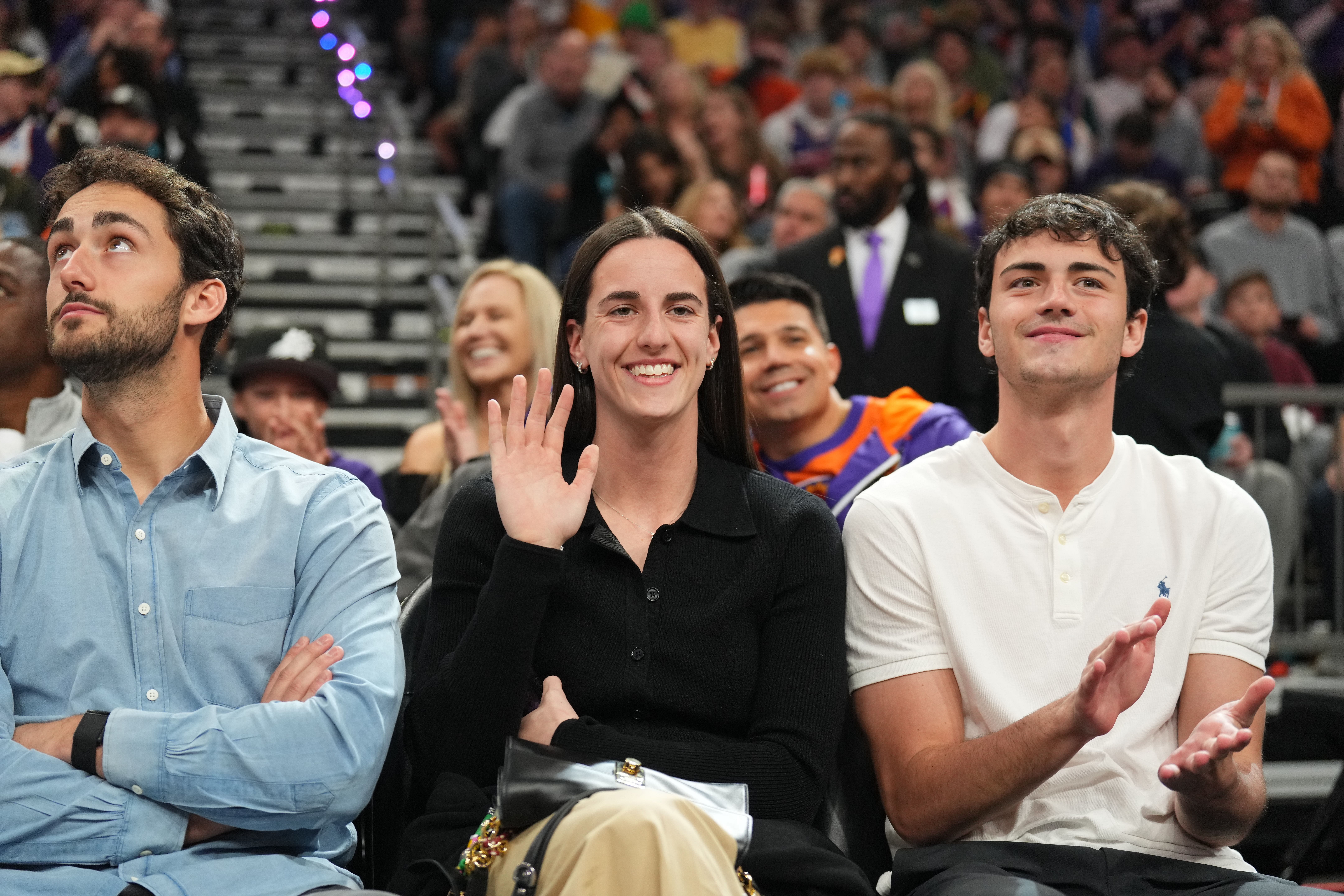 Indiana Fever player Caitlin Clark attends a game between the Phoenix Suns and the Golden State Warriors at Footprint Center - Photo Credit: Imagn