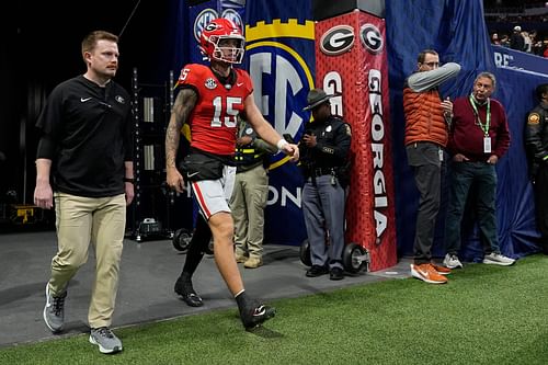 Carson Beck (15) takes the field to warm up - Source: Imagn