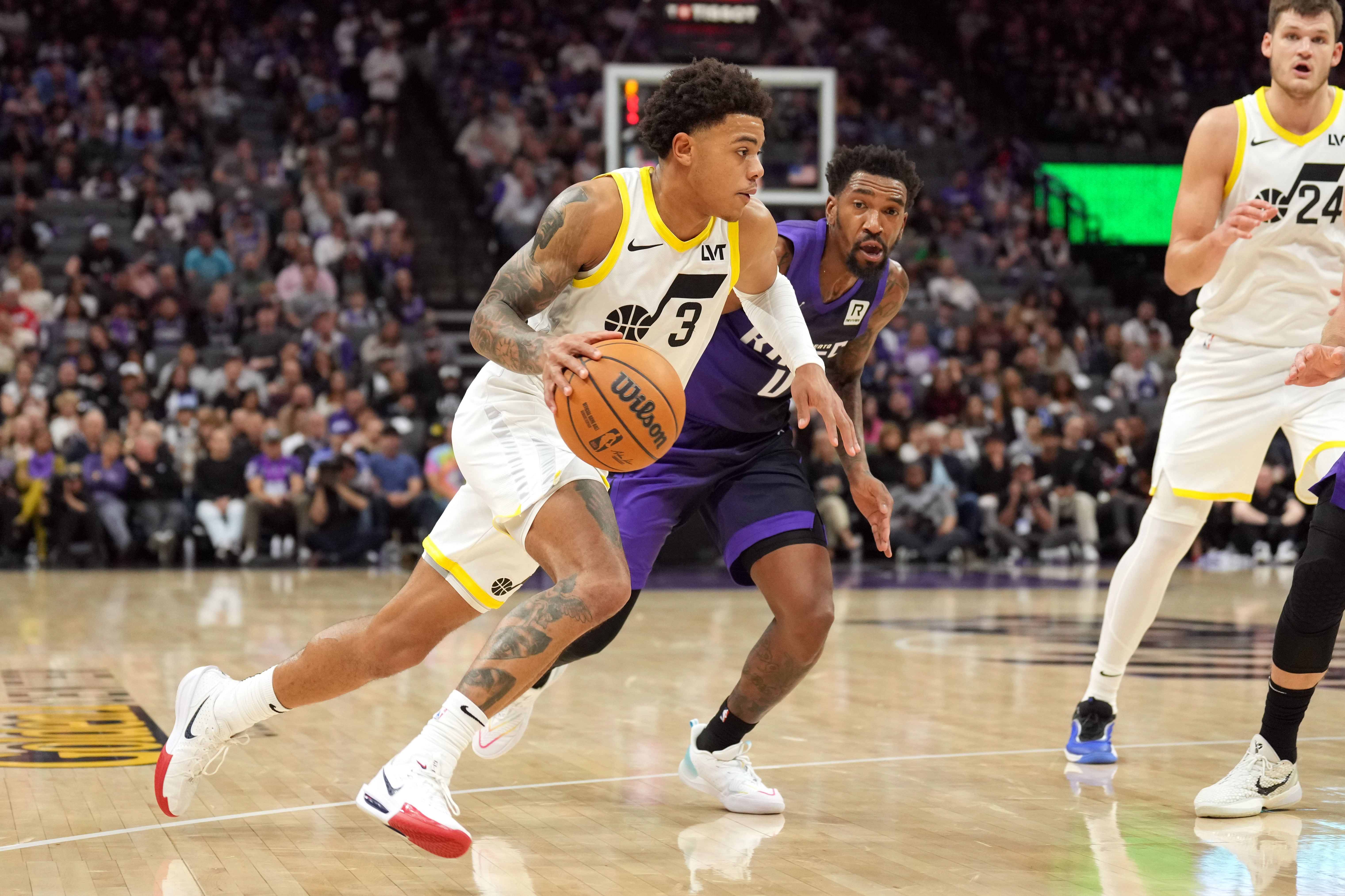 Utah Jazz guard Keyonte George dribbles against Sacramento Kings guard Malik Monk at Golden 1 Center. Photo Credit: Imagn