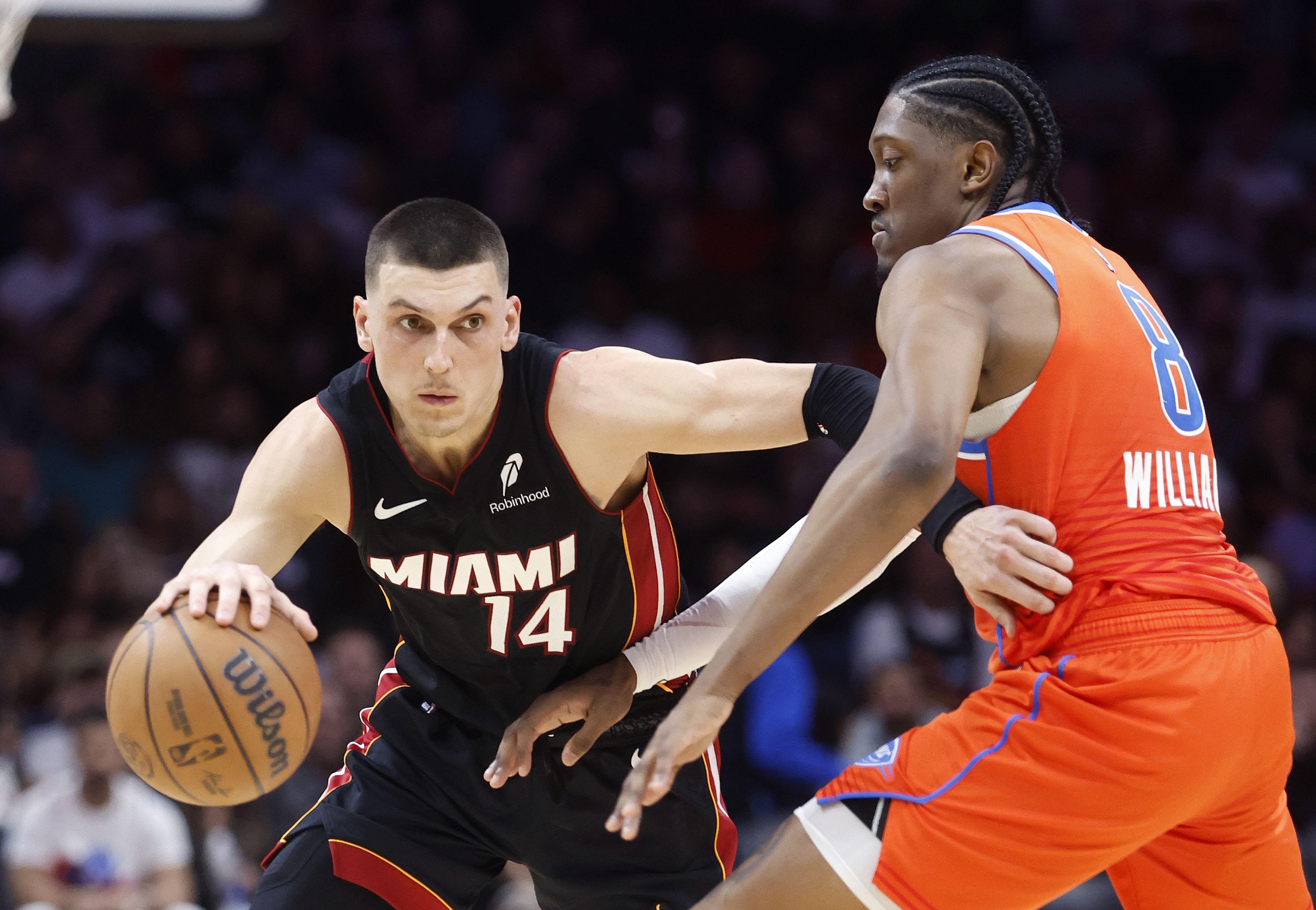 OKC Thunder forward Jalen Williams defends Miami Heat guard Tyler Herro at Kaseya Center. Photo Credit: Imagn