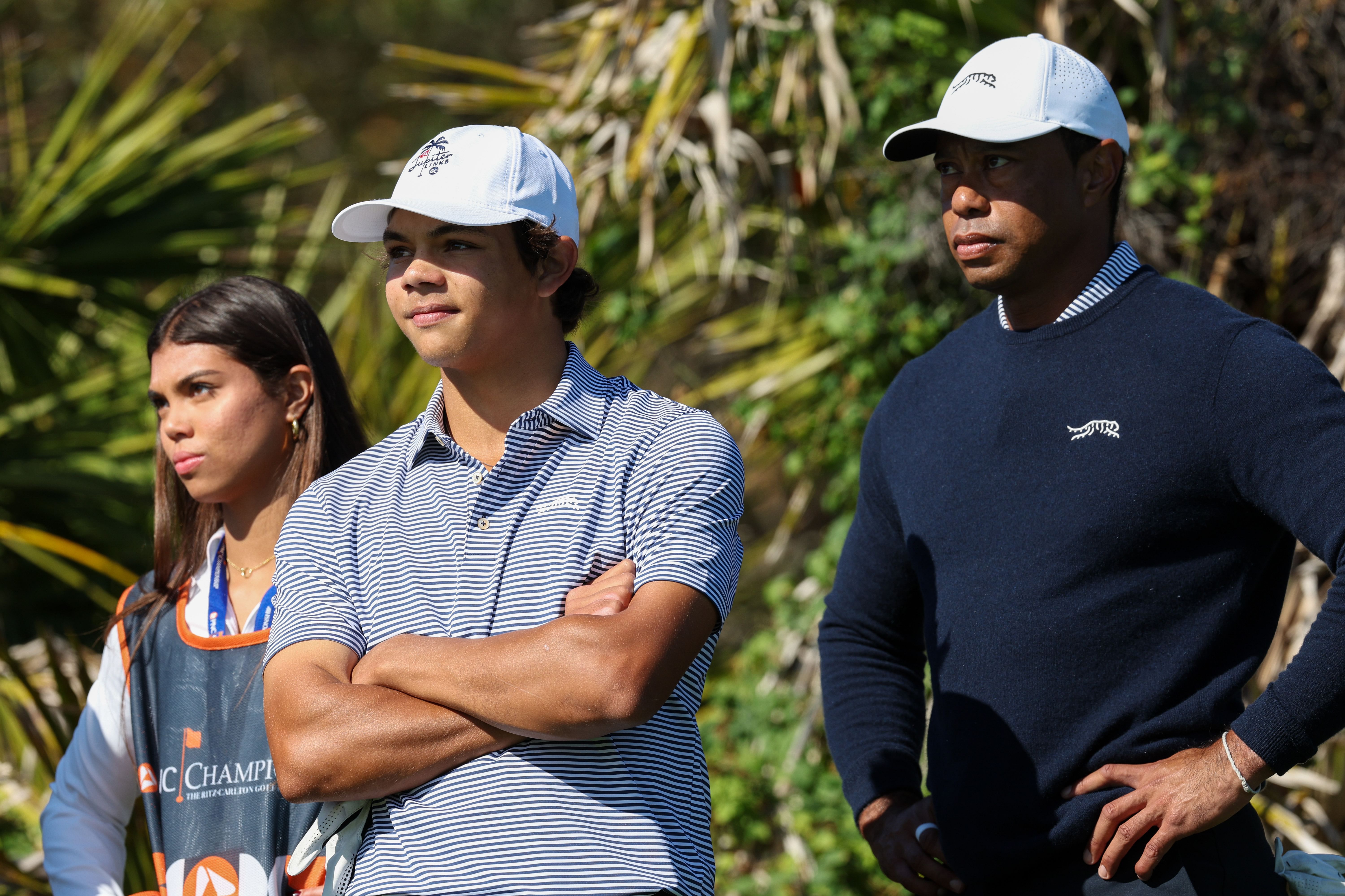 Tiger Woods and his two children (Image via Imagn)