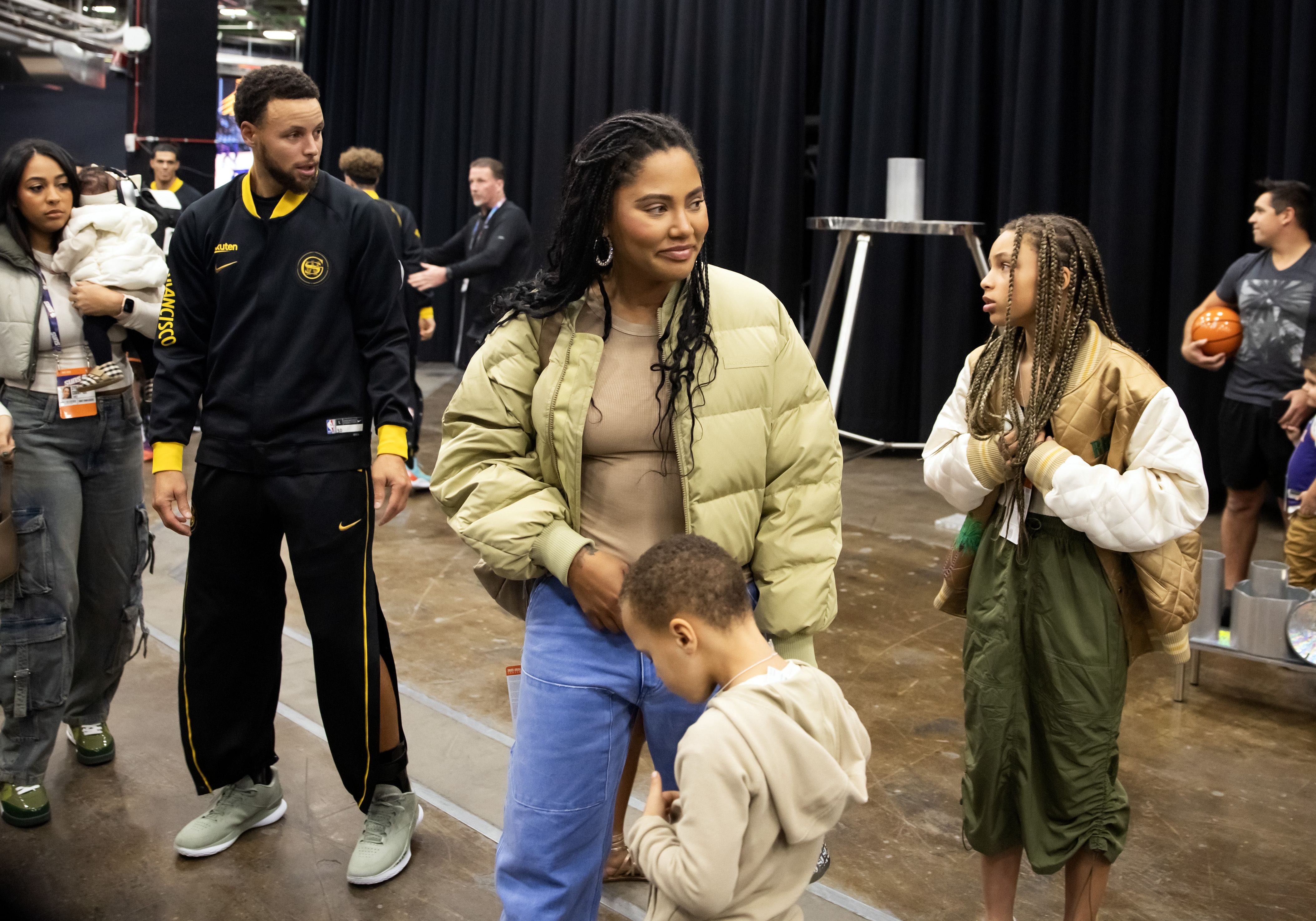 Nov 22, 2023; Phoenix, Arizona, USA; Golden State Warriors guard Stephen Curry (30) with wife Ayesha Curry prior to the game against the Phoenix Suns at Footprint Center. Mandatory Credit: Mark J. Rebilas-USA TODAY Sports - Source: Imagn