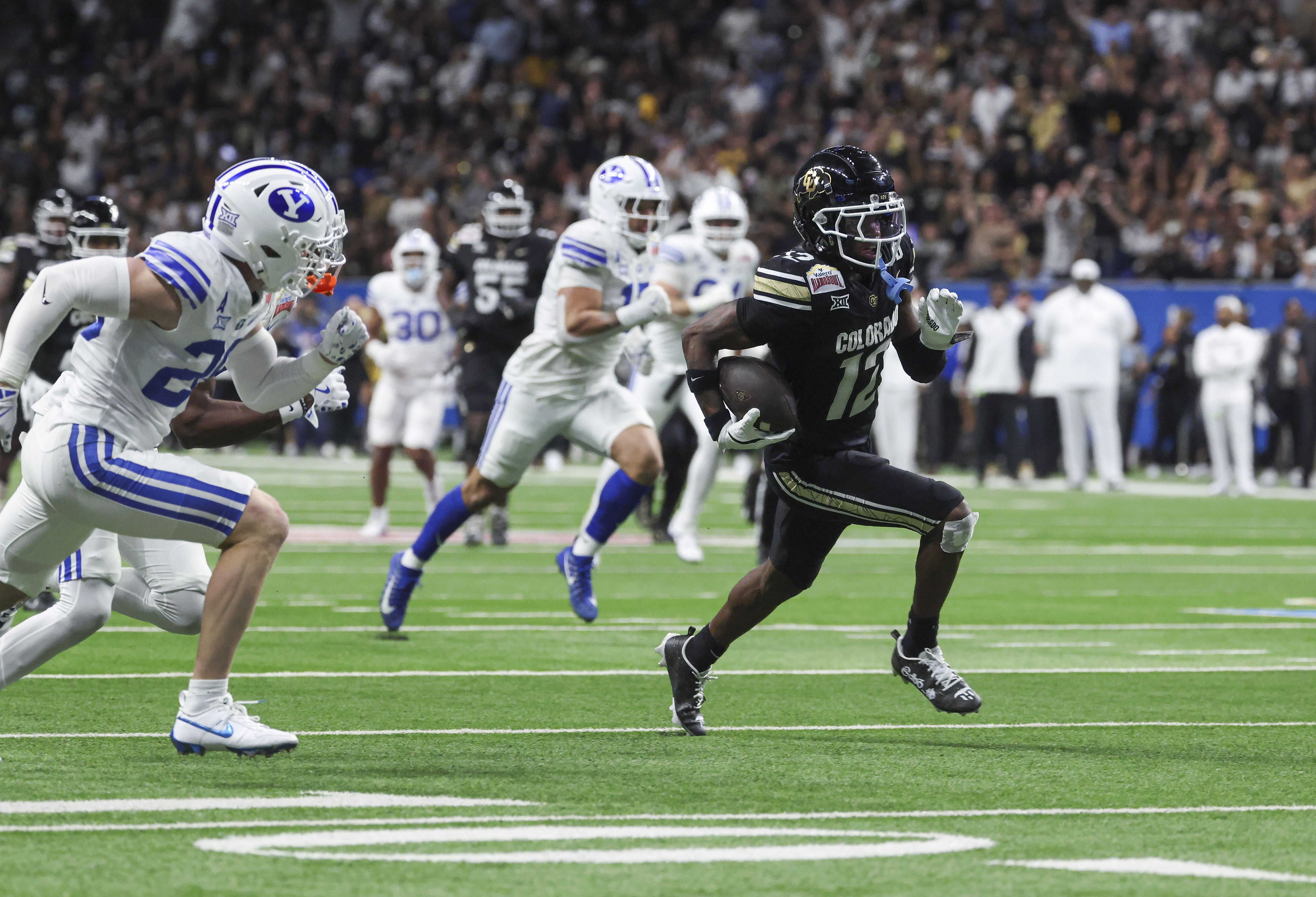 Colorado Buffaloes wide receiver Travis Hunter (12) runs with the ball and scores a touchdown during the Alamo Bowl. (Credits: IMAGN)